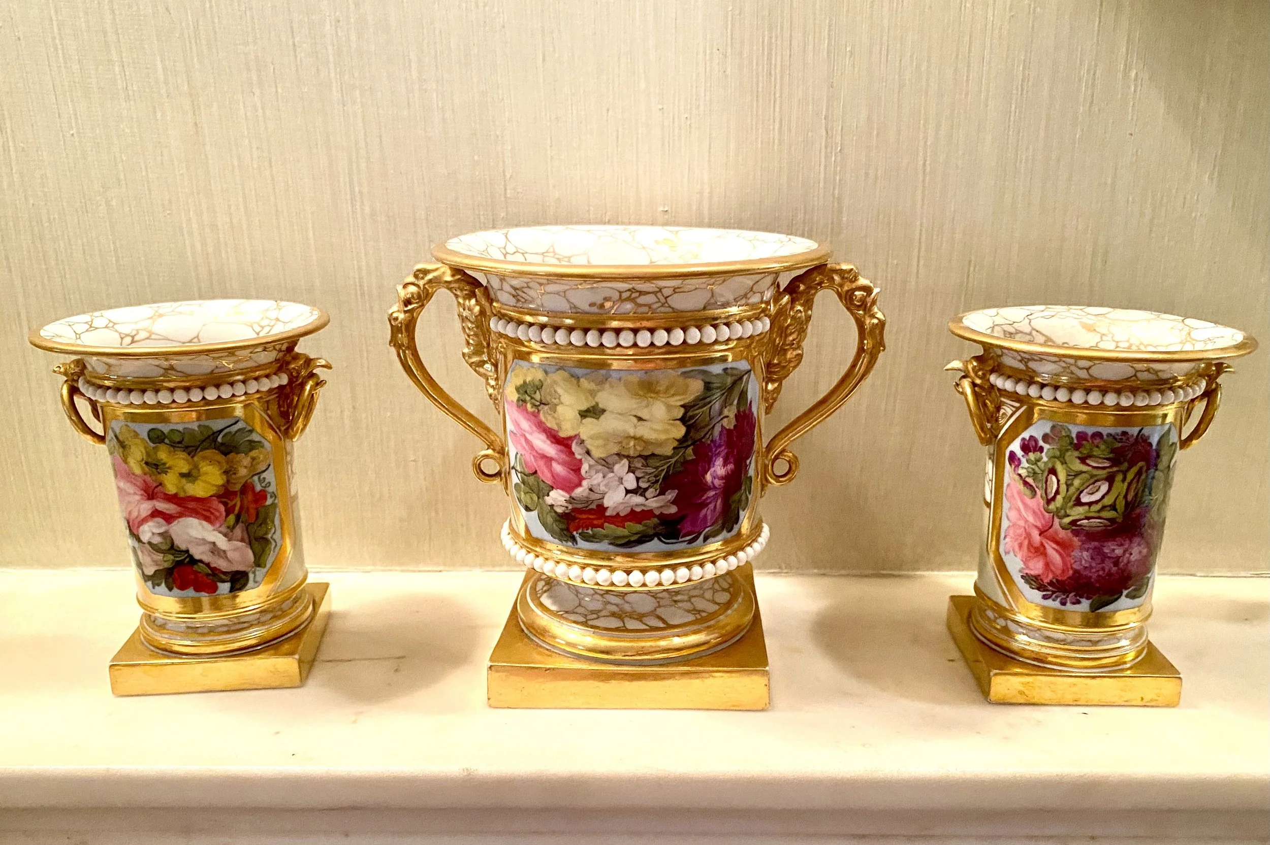 Barr Flight and Barr Garniture comprising a Pair of Gilt and Floral Decorated Coupes and a Larger Matching Handled Coupe/Vase, England, 1804 - 1813, Detailed manufacturers information to the base