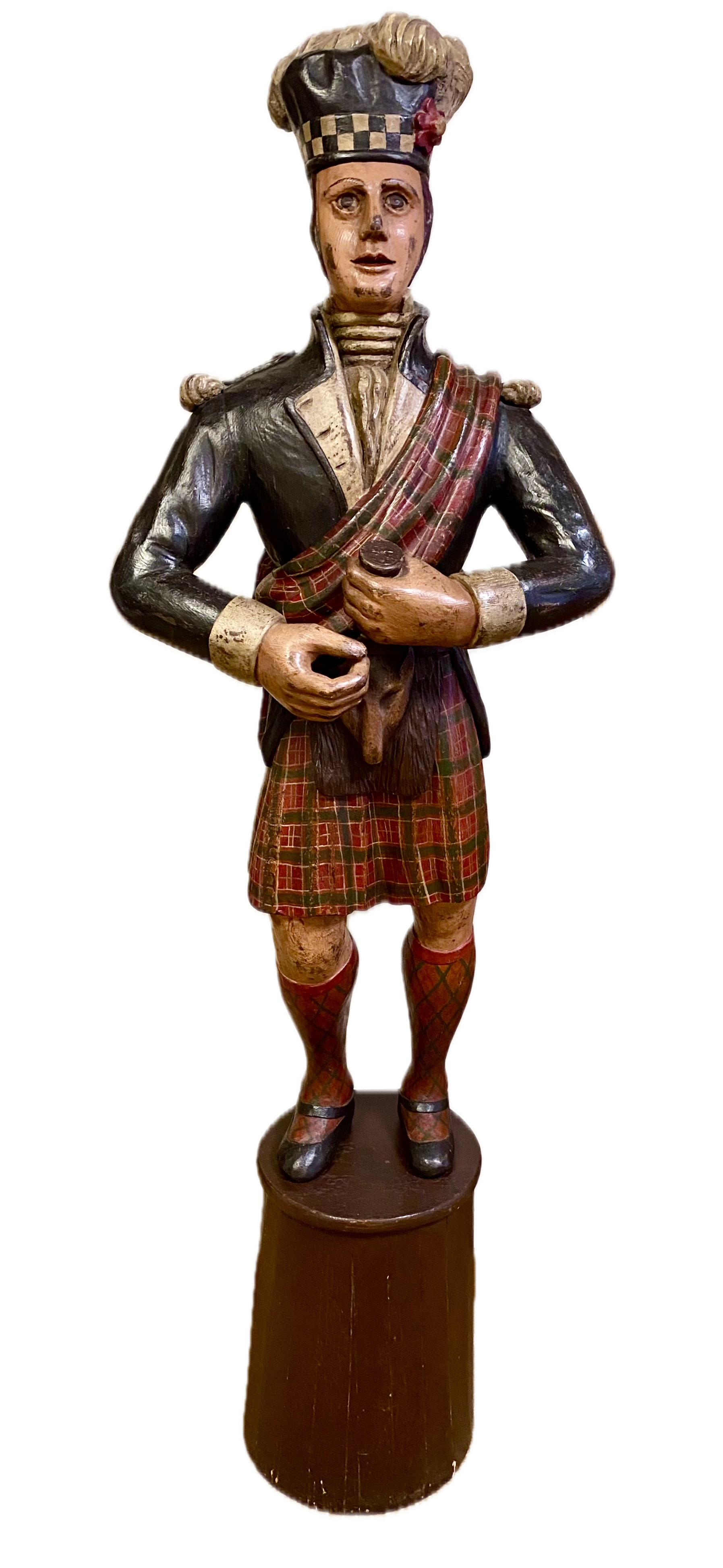 American carved and polychromed Cigarstore figure, 3rd Quarter 19th Century,
Carved in the form of a Scotsman, set on a cylindrical base
Height of figure: 46 inches
