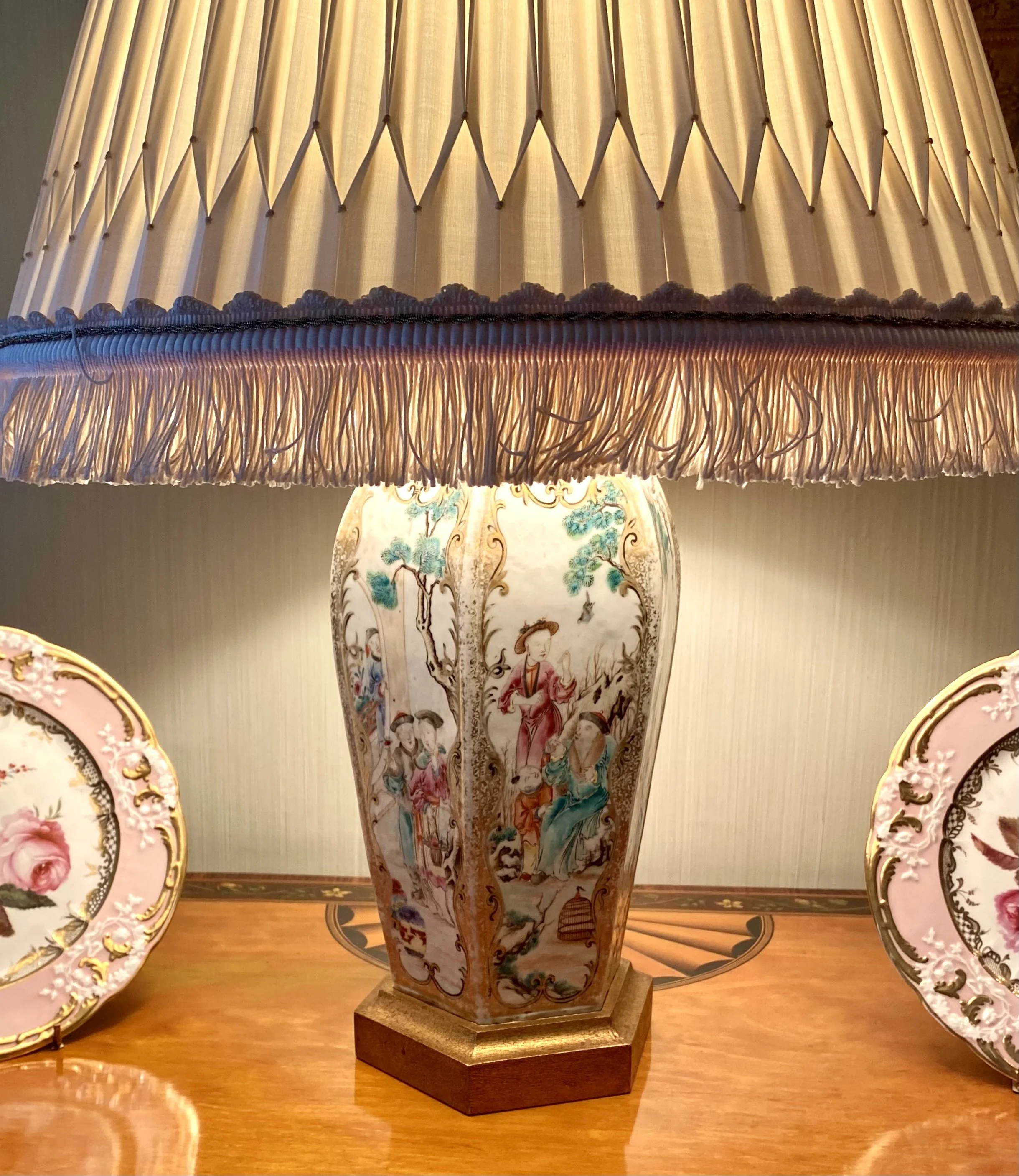 Pair of Chinese Famille Rose Hexagonal Baluster Vases, with Figural Vignettes, 19th century; Now Mounted as Lamps on Giltwood Bases. Provenance: Kentshire, New York