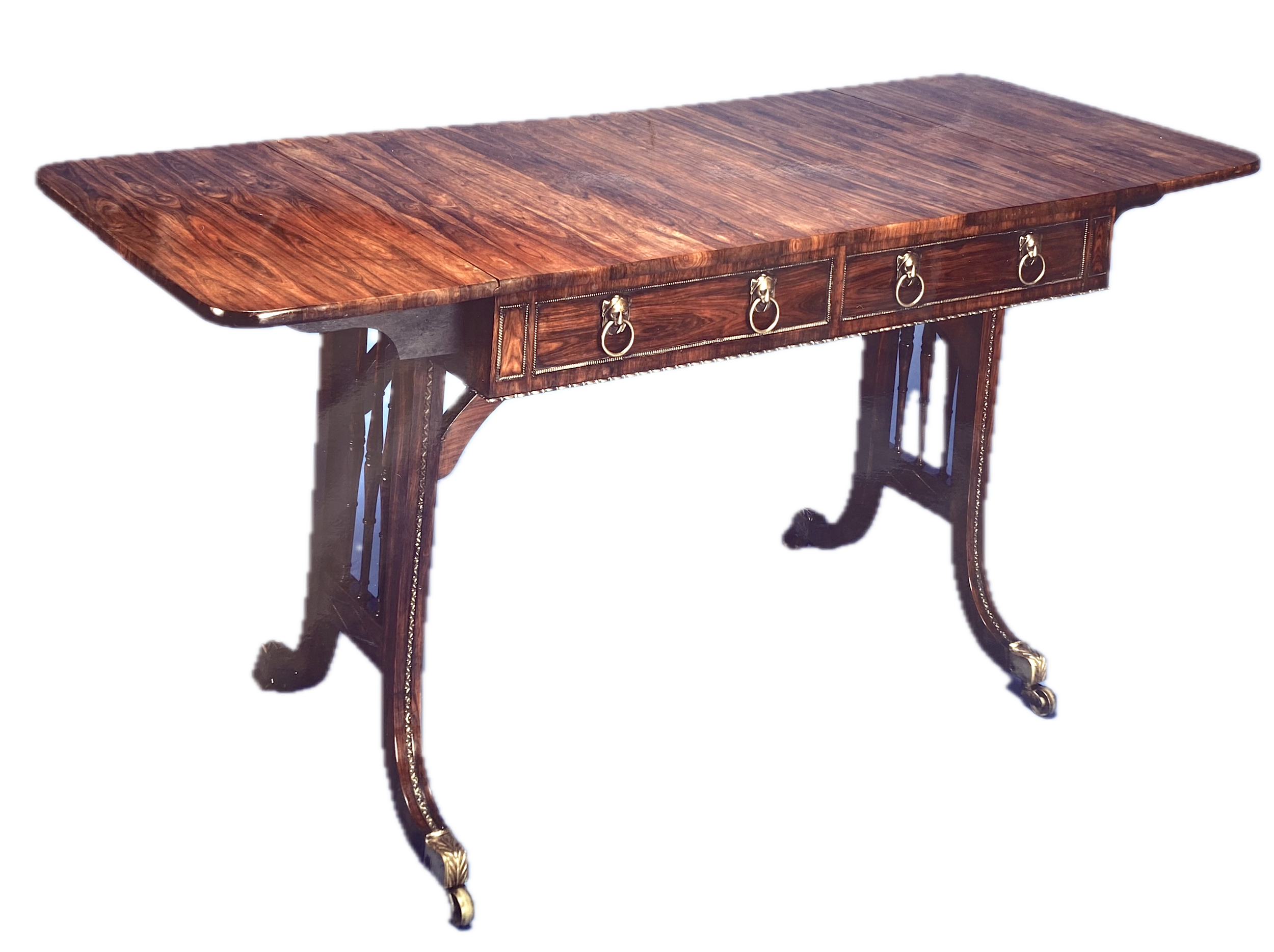 Very Fine and Rare Regency Kingwood Sofa Table with Gilt Brass Lion Head Handles, c. 1820 (60 ½ inches long (when open) x 25 inches deep x 29 inches high) Provenance: Philip Hewat-Jaboor