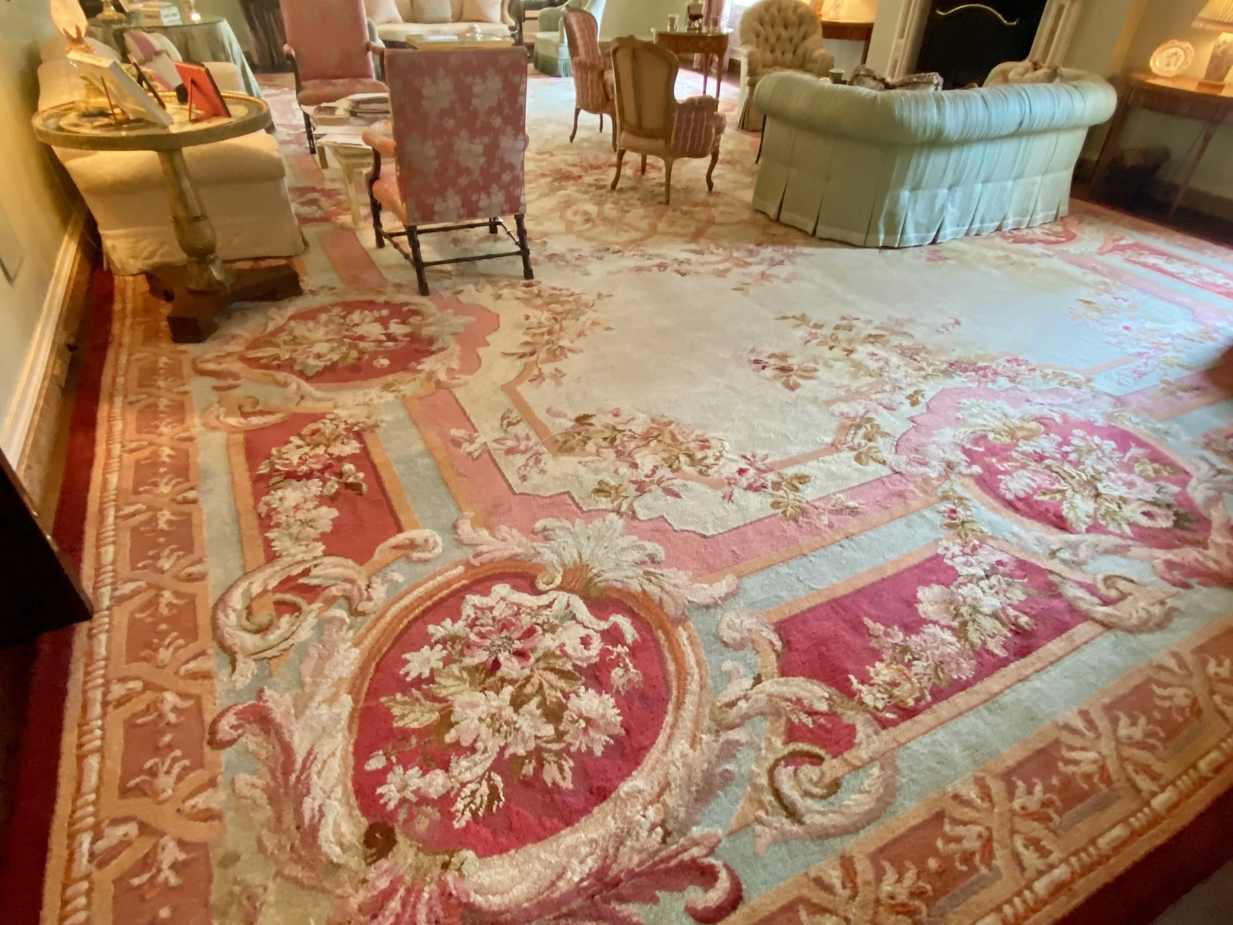 Monumental French Louis Philippe Period Savonnerie Rug, 2nd Quarter 19th Century;
Having a central lattice medallion filled with flowers and architectural borders of aqua, rose, and wine in a field of Ivory
(32’ x 20’ approximate size)
Provenance: Pa