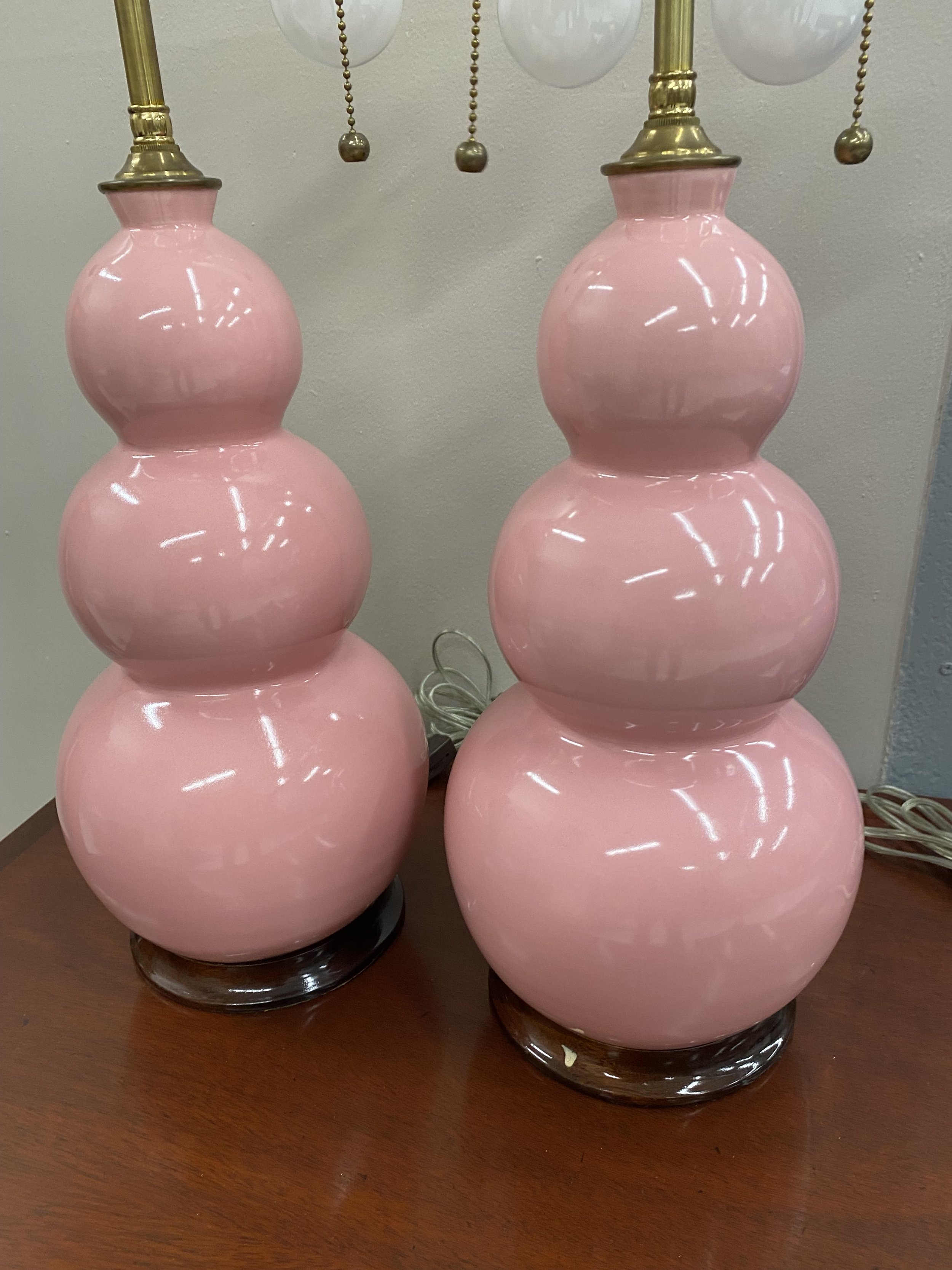 Pair of Pink Glazed Ceramic Vases, Now Wired as Lamps, with shades
Size: Vases are 15 inches high; 24 inches high to shade rest
