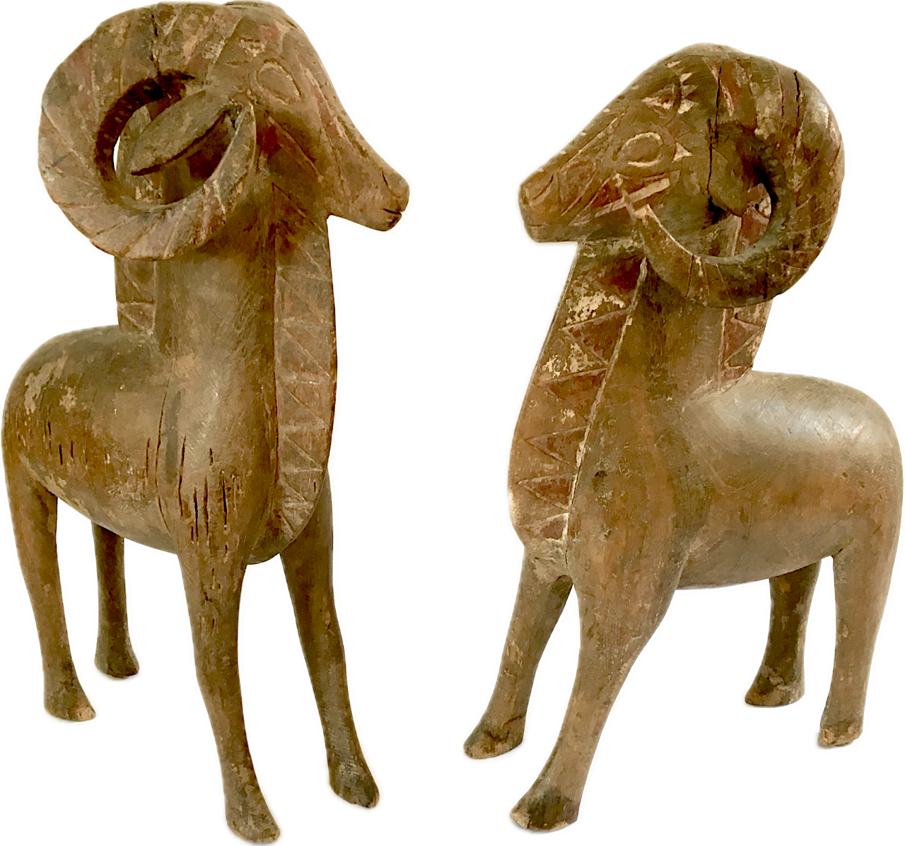 Pair of Carved Wood and Polychrome Painted
African Fertility Figures in the Form of Rams, 20th Century; The larger: 25 inches tall x 16 inches long x 8 inches wide