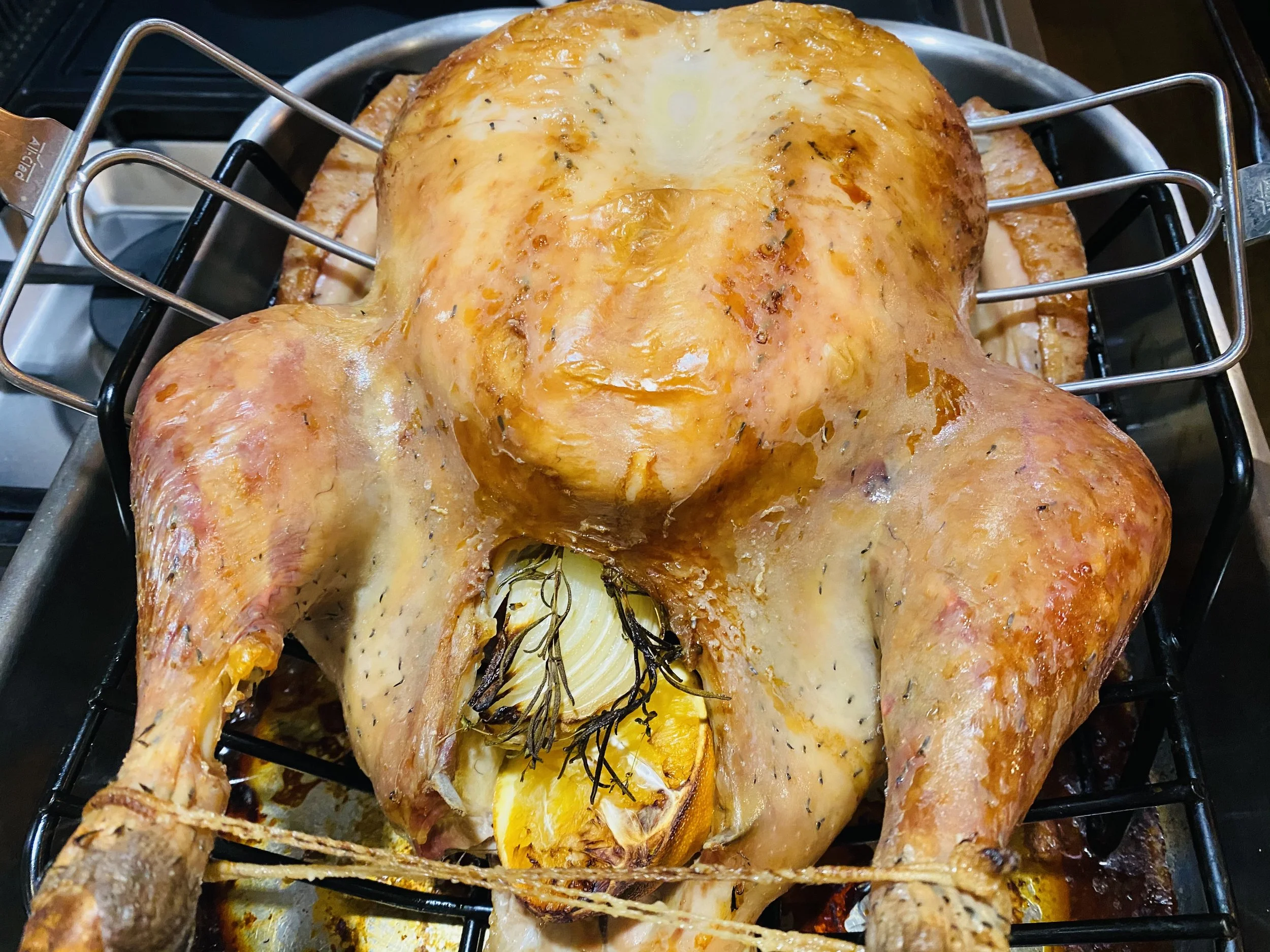 Roasted turkey cooked with a crispy, browned skin for The Best Turkey Recipe Ever from NRQi Studio.