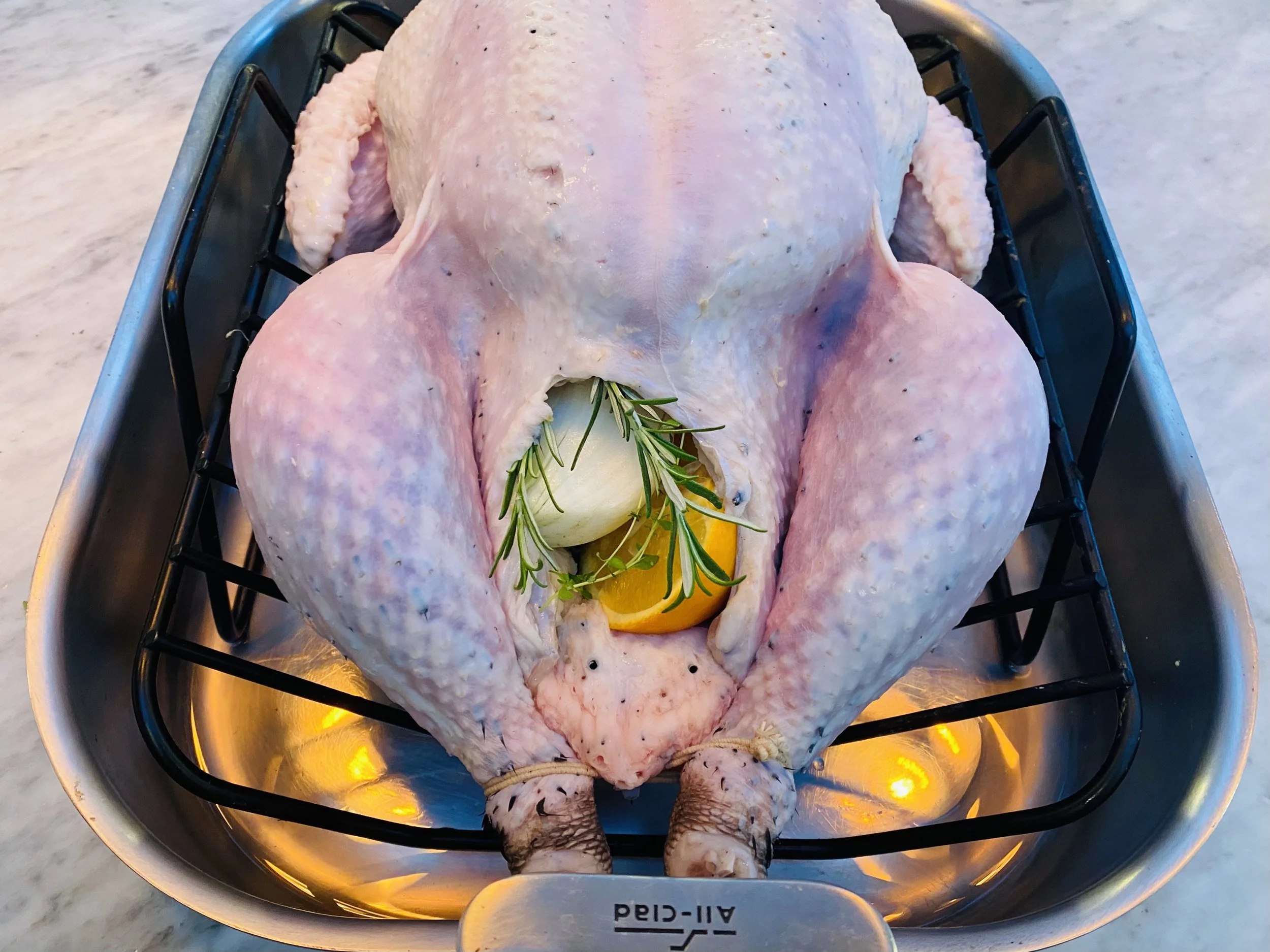 The prepared, raw turkey from The Best Turkey Recipe Ever from NRQi Studio.