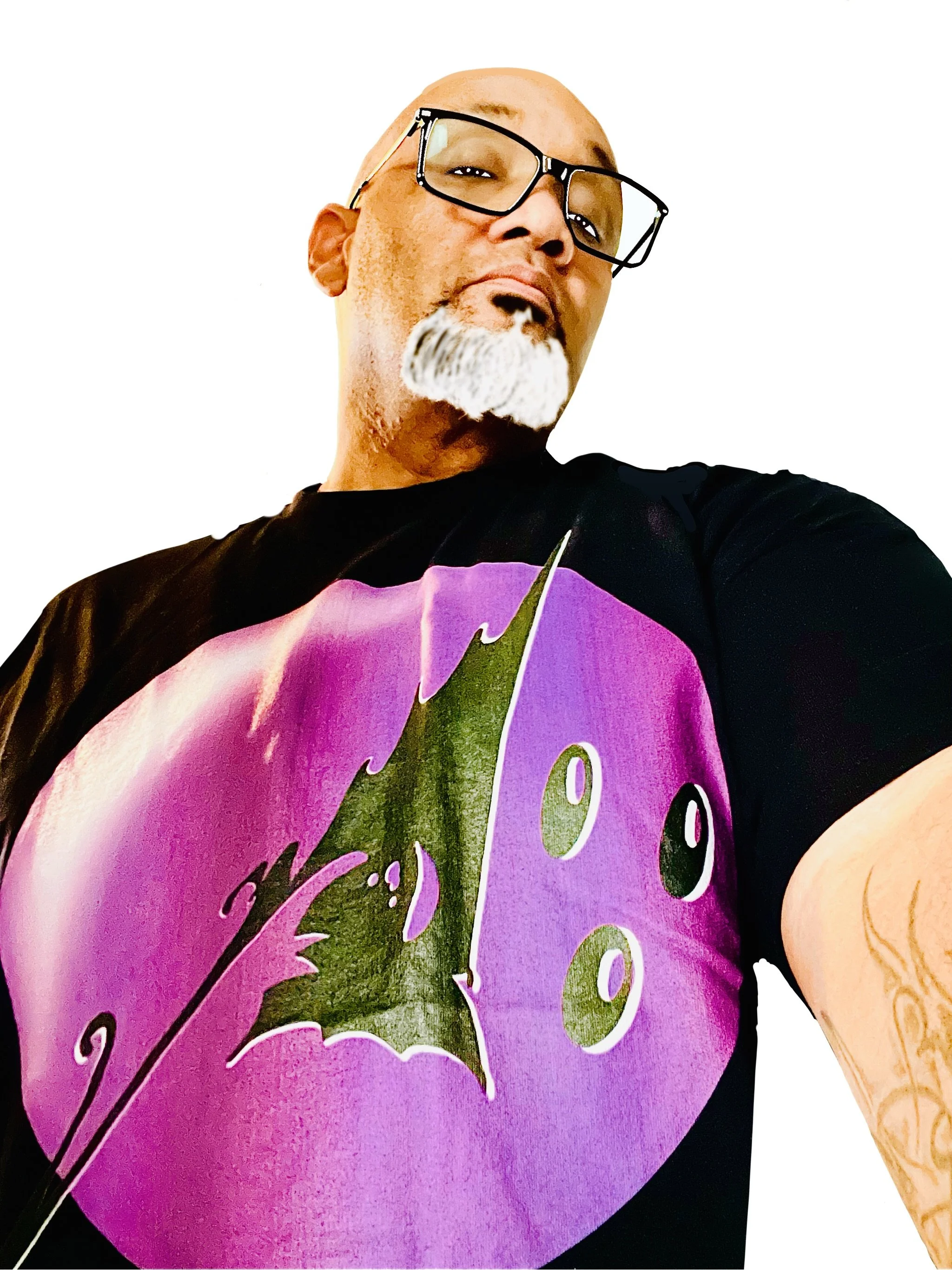 A person with glasses and a white beard taking a selfie, wearing a black T-shirt with a colorful graphic of a THINKTIMM logo