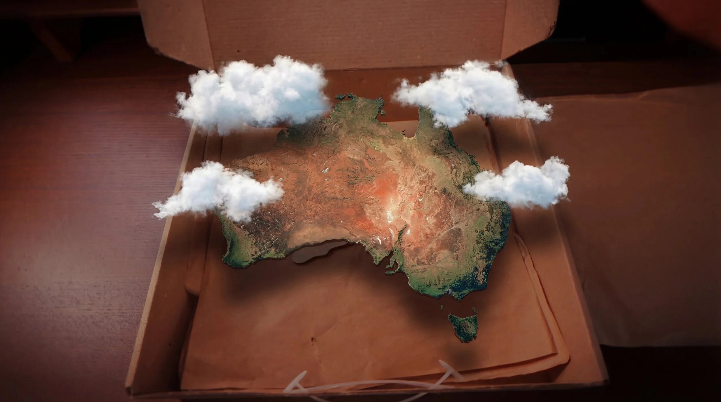 Mappa della Australia in scatola, con nuvole di carta sopra.