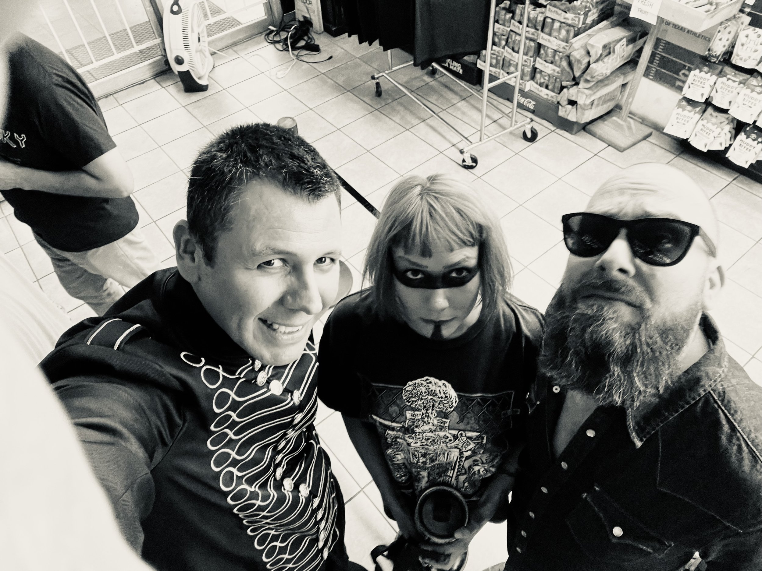 Selfie of four people in a convenience store, two women with makeup and sunglasses, one young man with curly hair, and an older man with a beard. . My Mistress at Rio Market Chace Levi Lacey Kay Levi Martin Leal