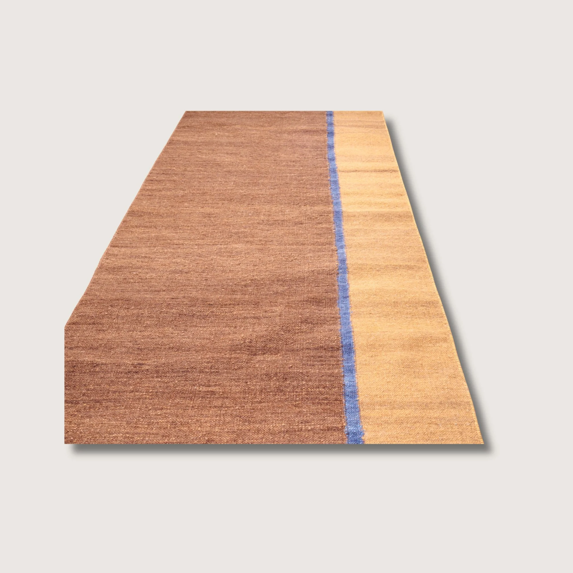 Straight view of Rekha Ek runner with single blue line detail and natural wool texture