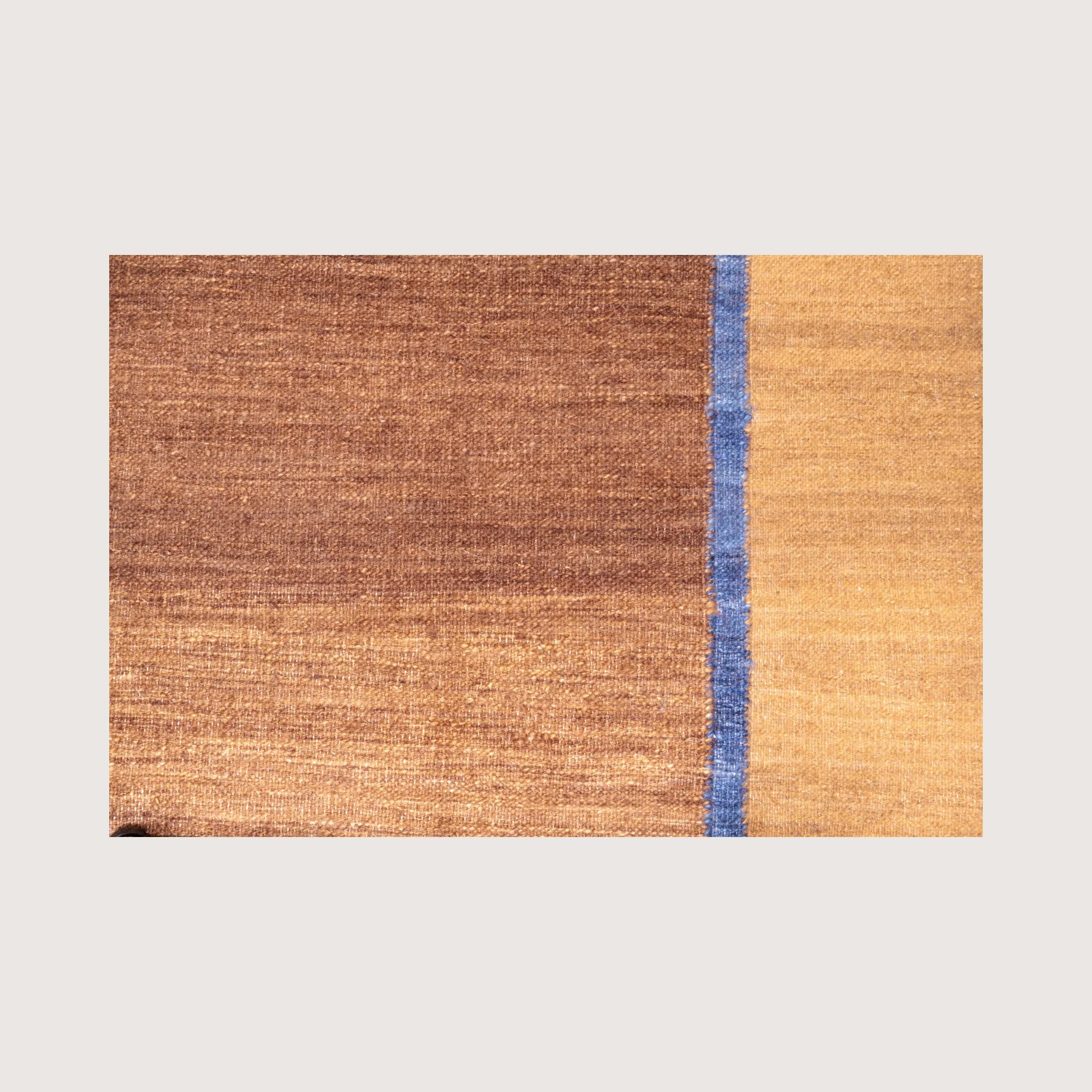 Close-up of Rekha Ek runner showing handwoven texture and blue line detail