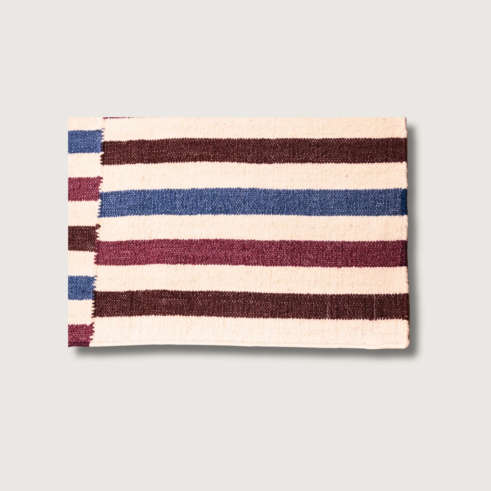 Saanjh rug showing striped pattern, texture and color variation