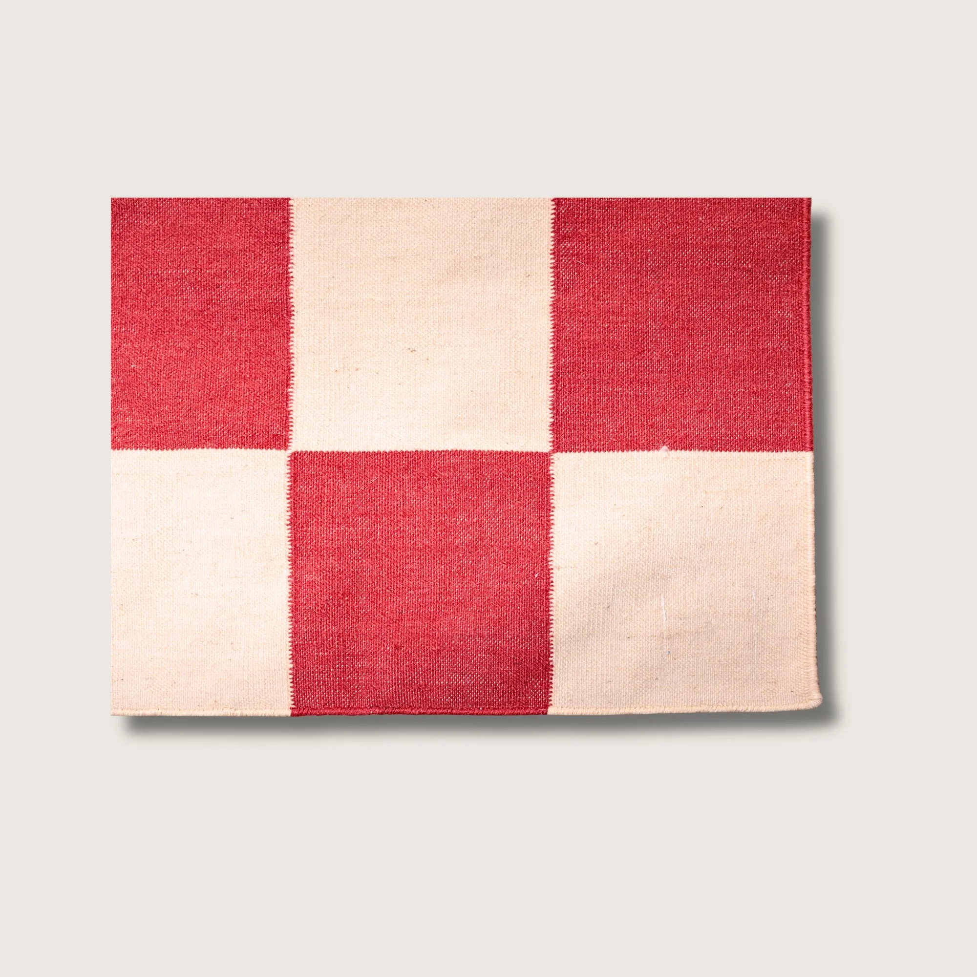 Khana Laal rug showing checkered pattern, texture and color contrast