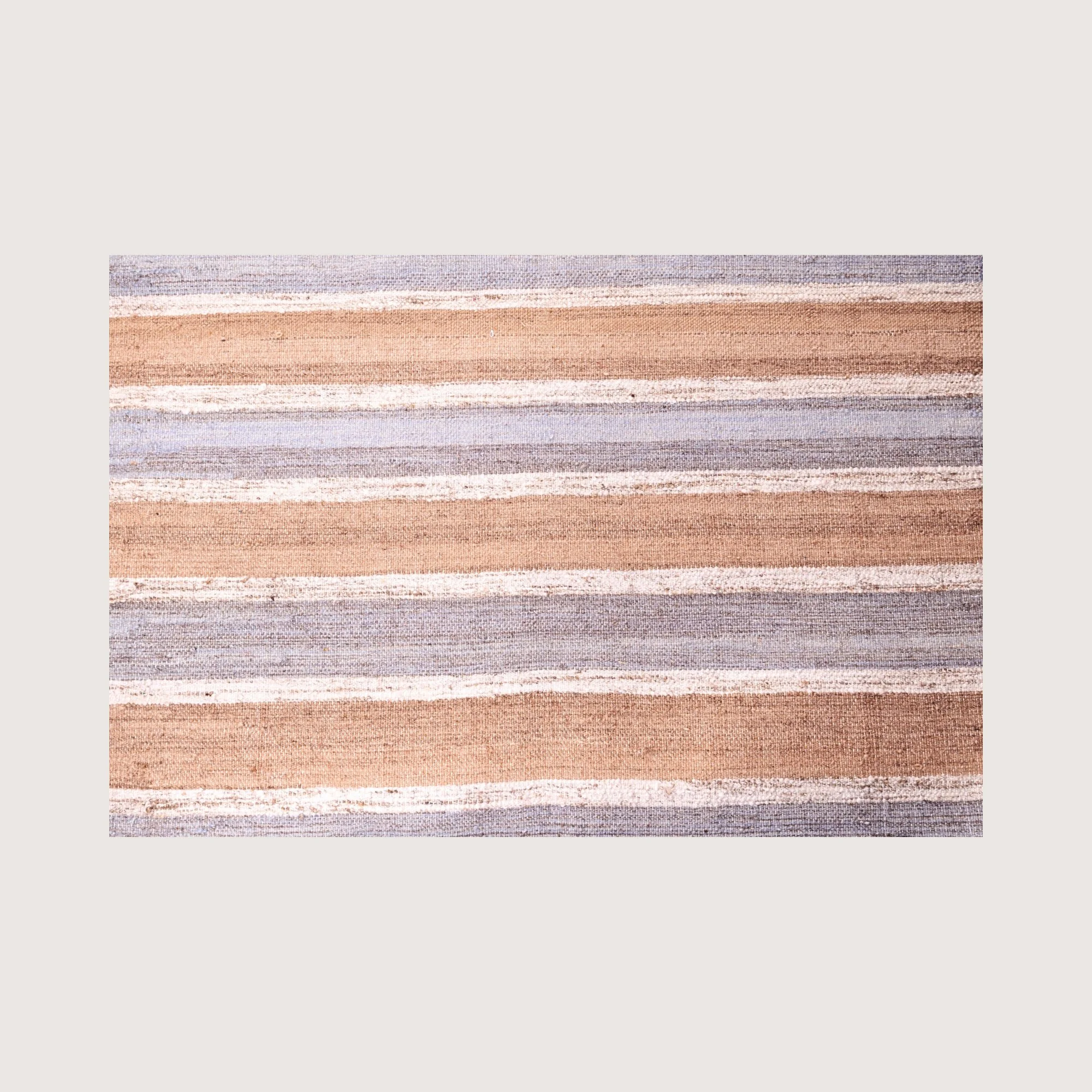 Close-up of Dhaariya Neel rug showing handwoven texture and stripe detail