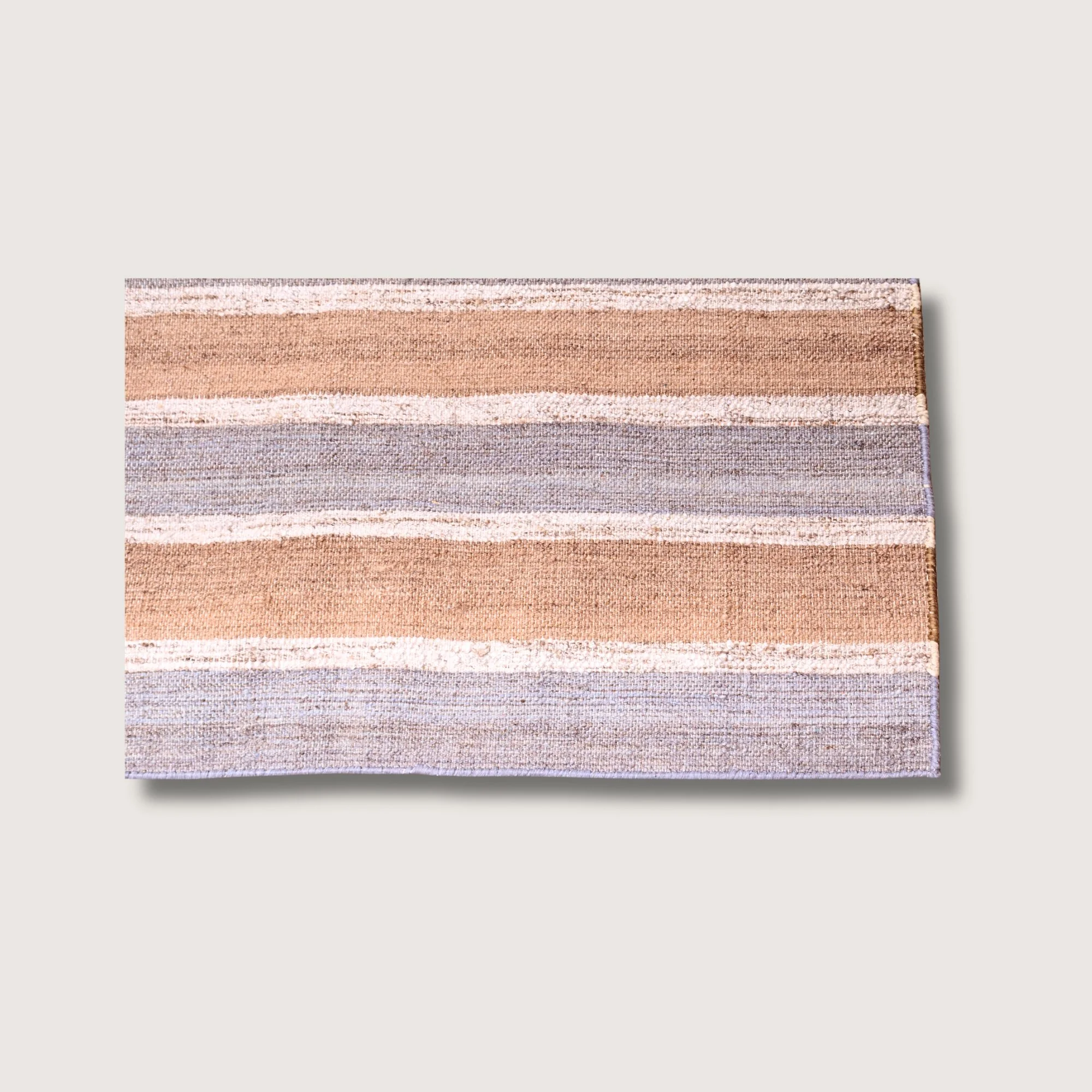 Dhaariya Neel rug showing striped pattern, texture and color variation