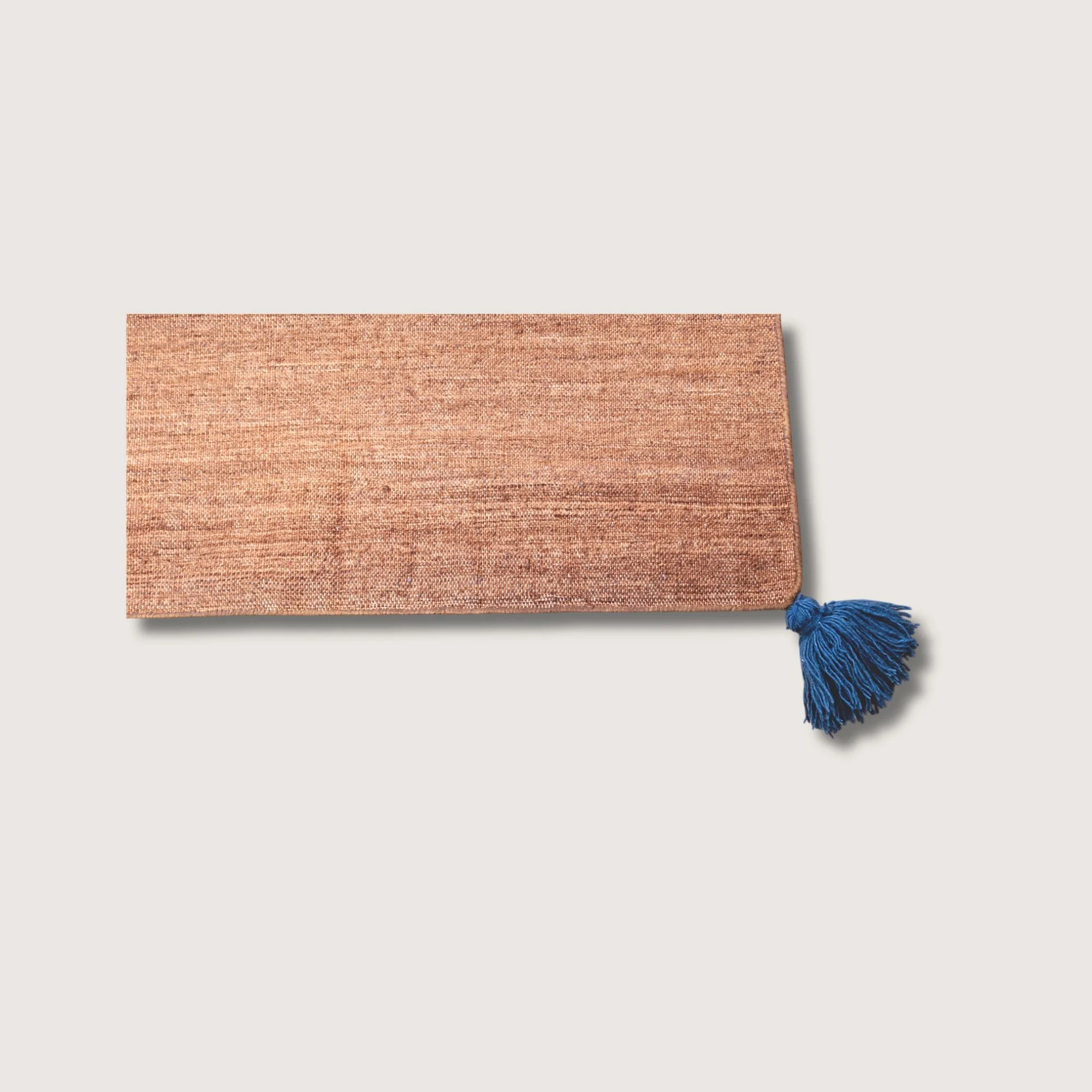 Lakir Neel rug showing texture, earthy tones and tassel detail