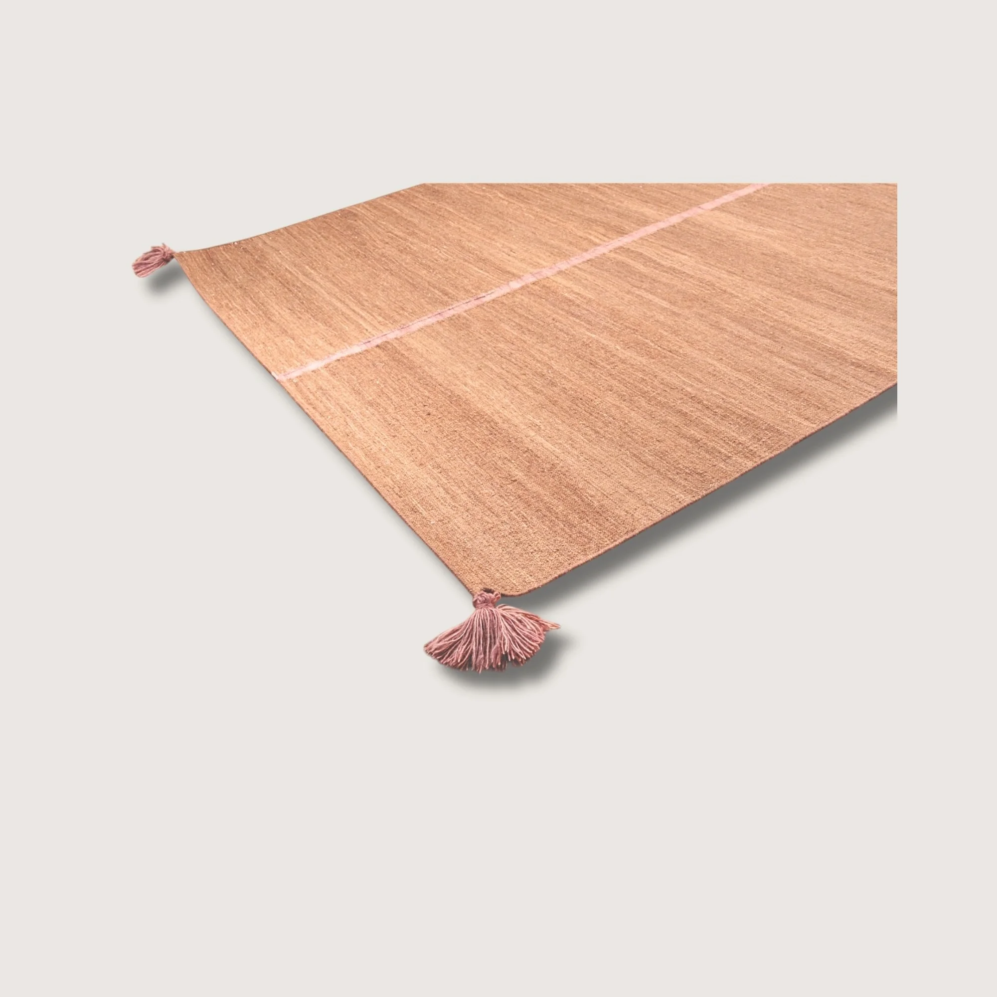 Angled view of Lakir Gulab rug with pink line detail and natural wool texture