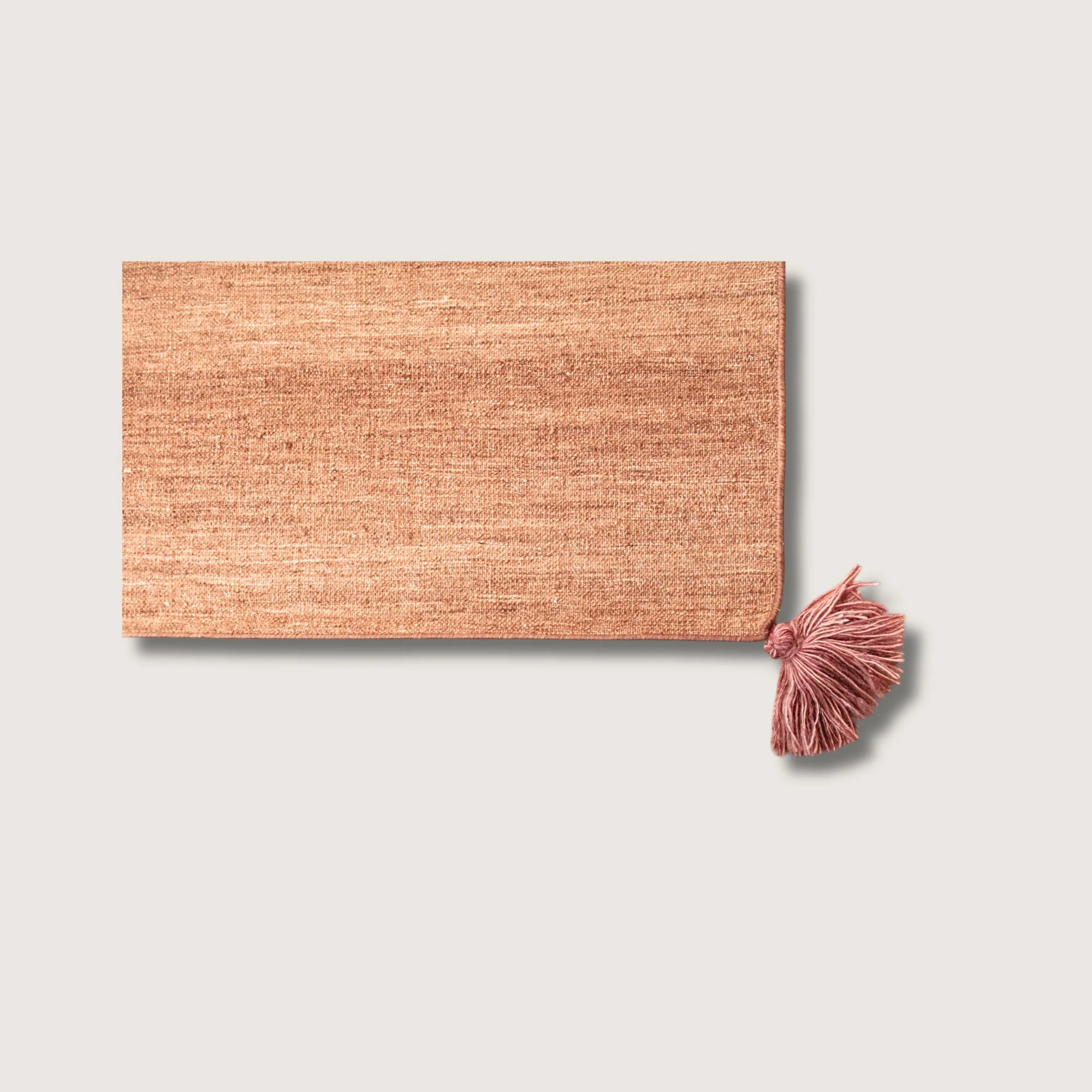 Lakir Gulab rug showing texture, warm tones and tassel detail