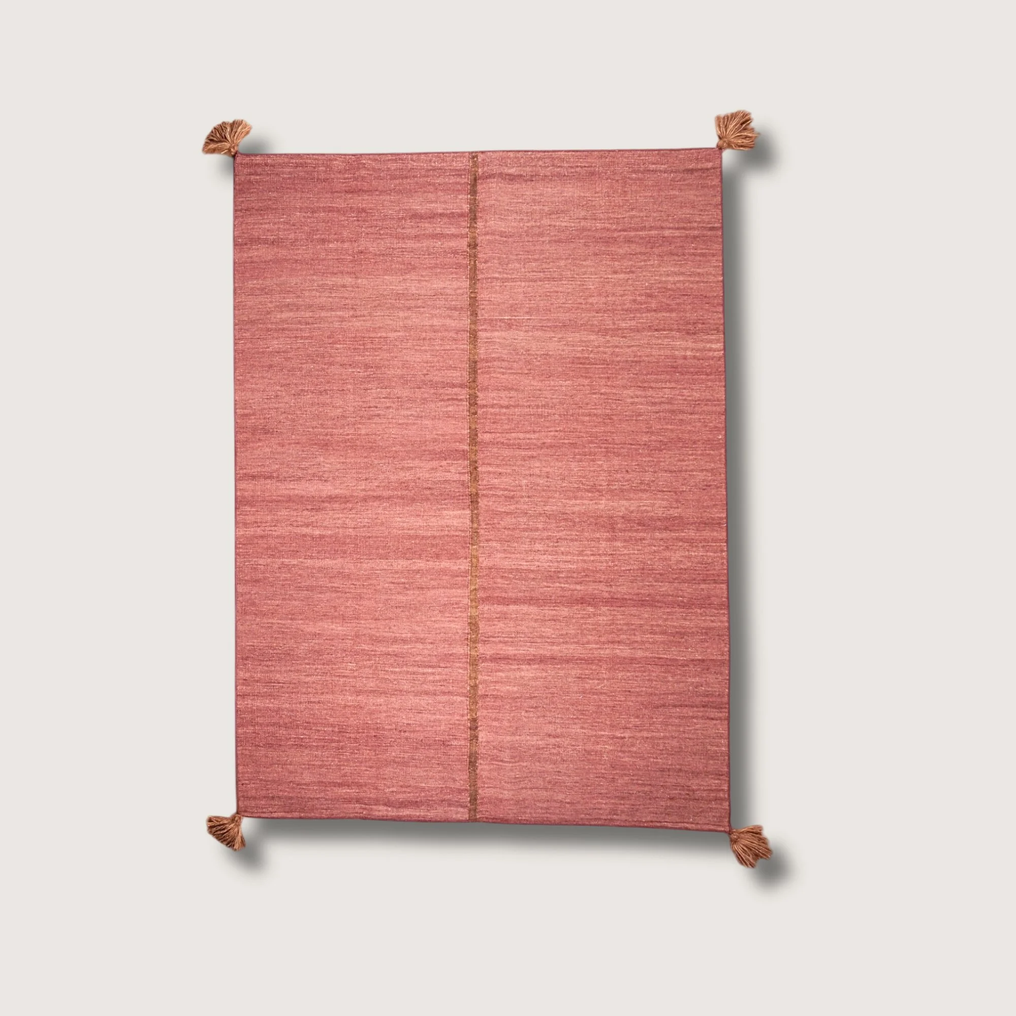 Lakir Mitti handwoven wool rug with soft rose tones and a single brown vertical line, minimal flatweave design