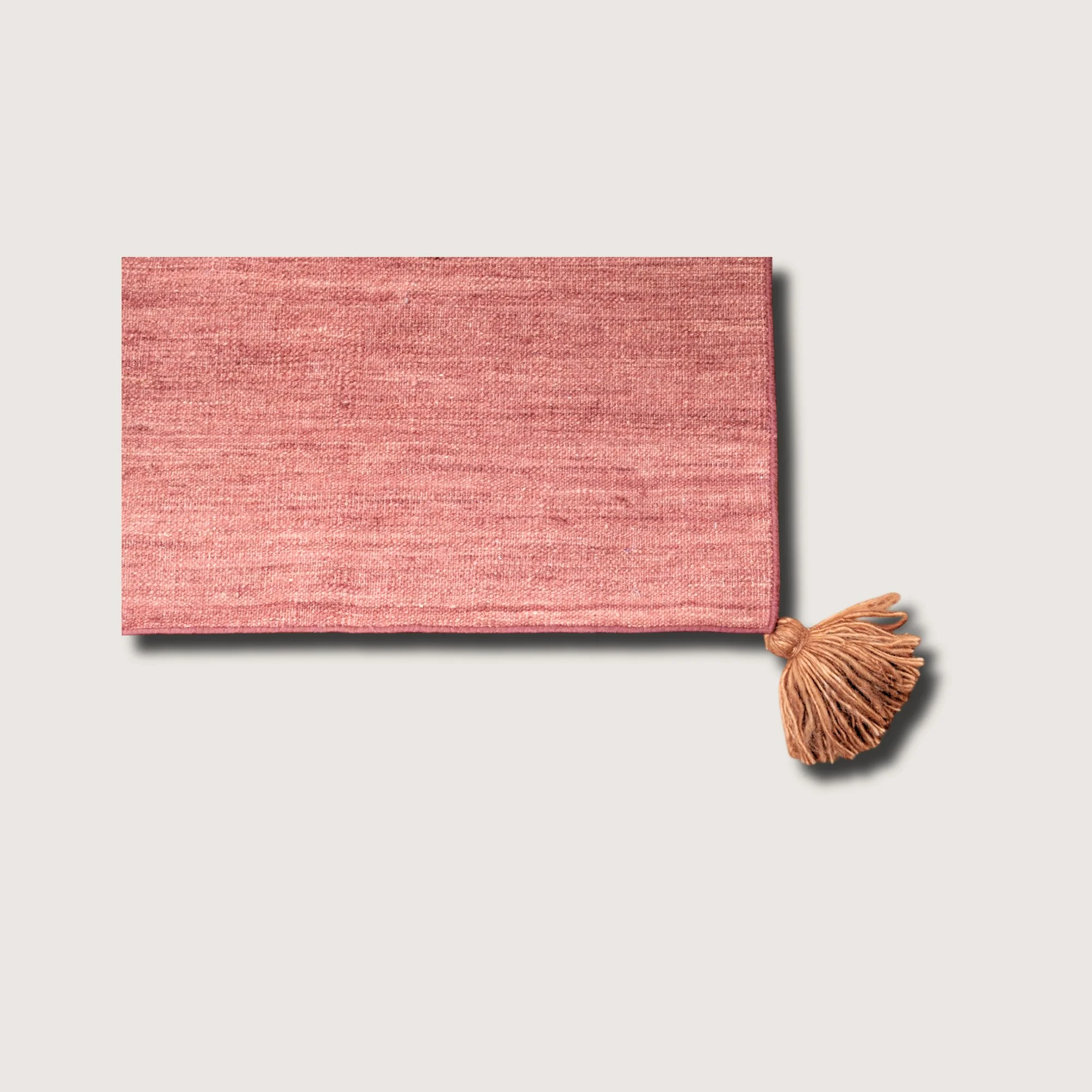 Lakir Mitti rug showing texture, soft tones and tassel detail