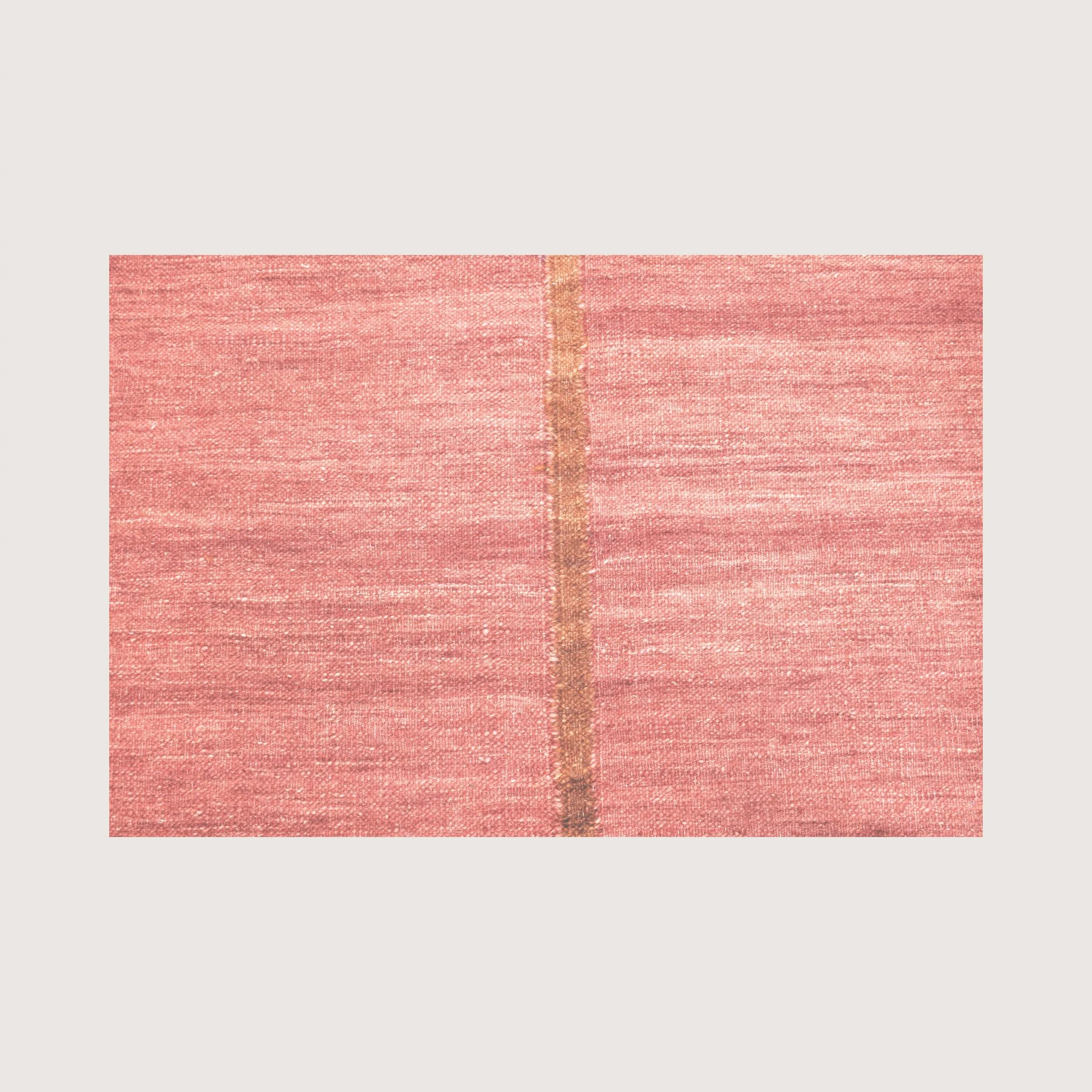 Close-up of Lakir Mitti rug showing handwoven texture and central brown line detail