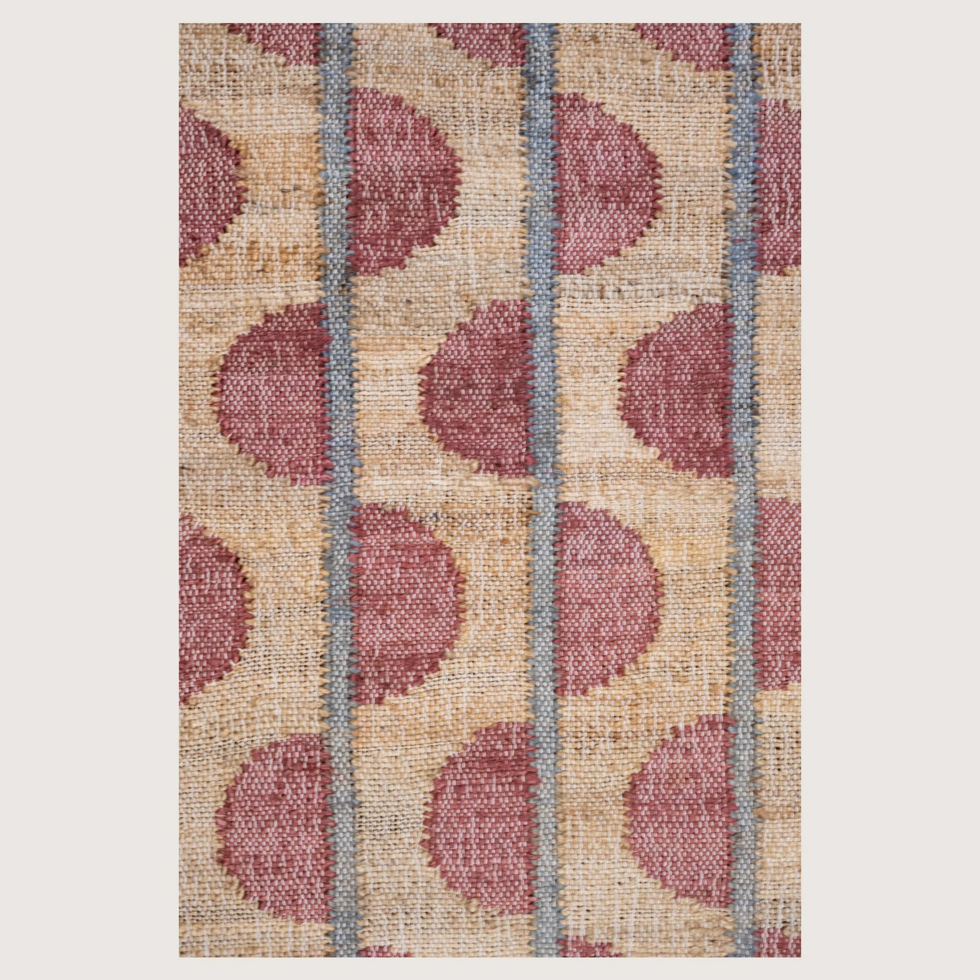 Handwoven jute runner with repeating half-moon pattern in dusty gulabi and natural sand tones.