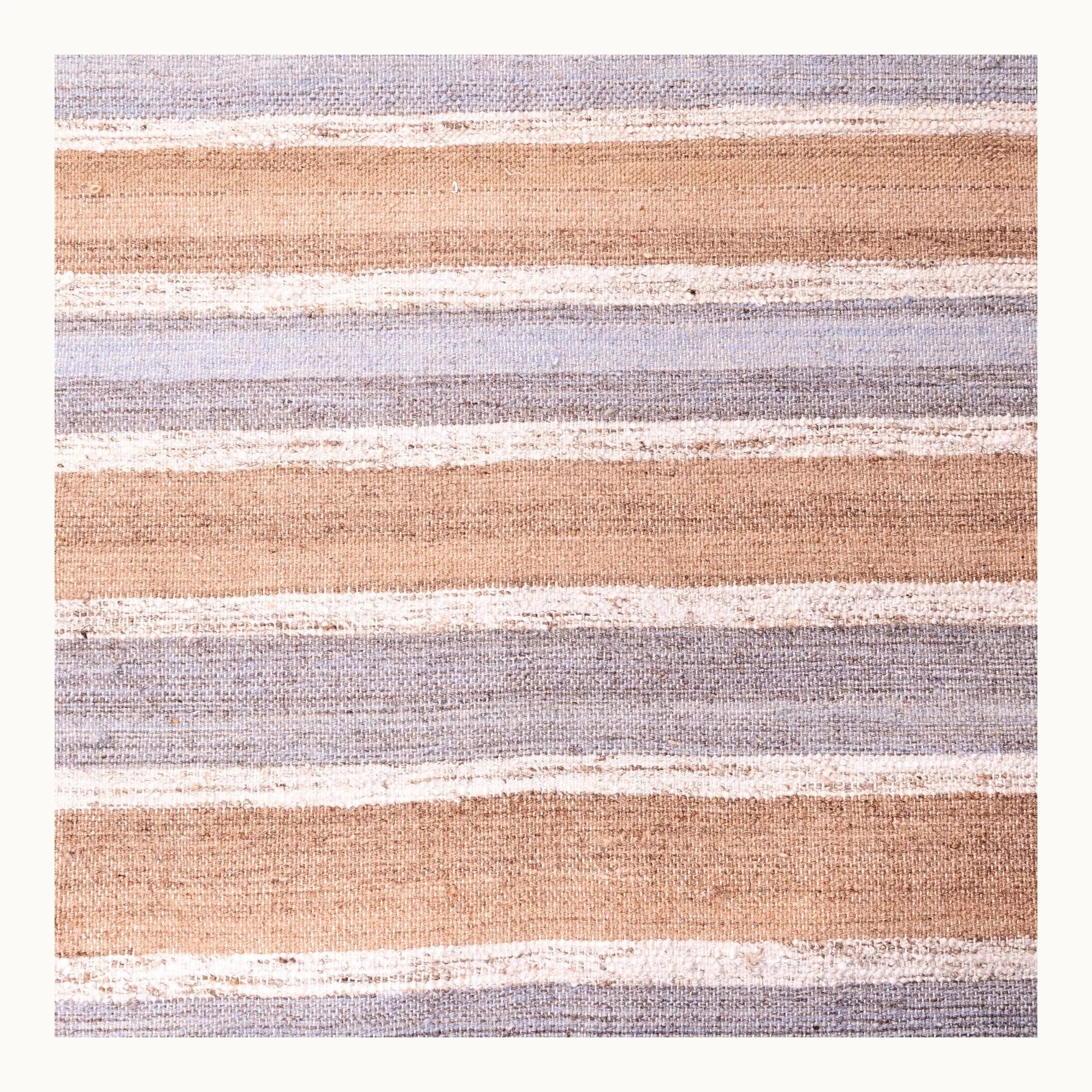 Dhaariya Neel handwoven striped wool rug with blue and natural tones, minimal flatweave design
