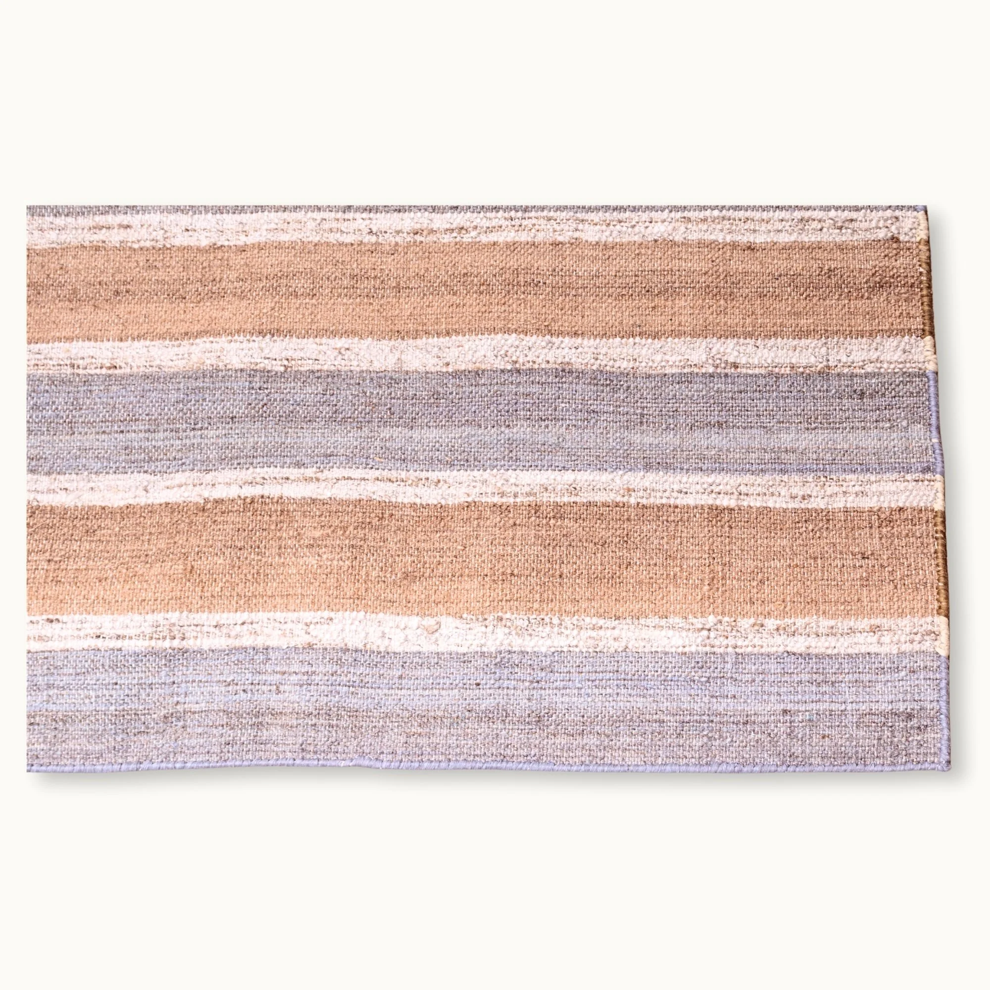 Dhaariya Neel handwoven striped wool rug with blue and natural tones, minimal flatweave design