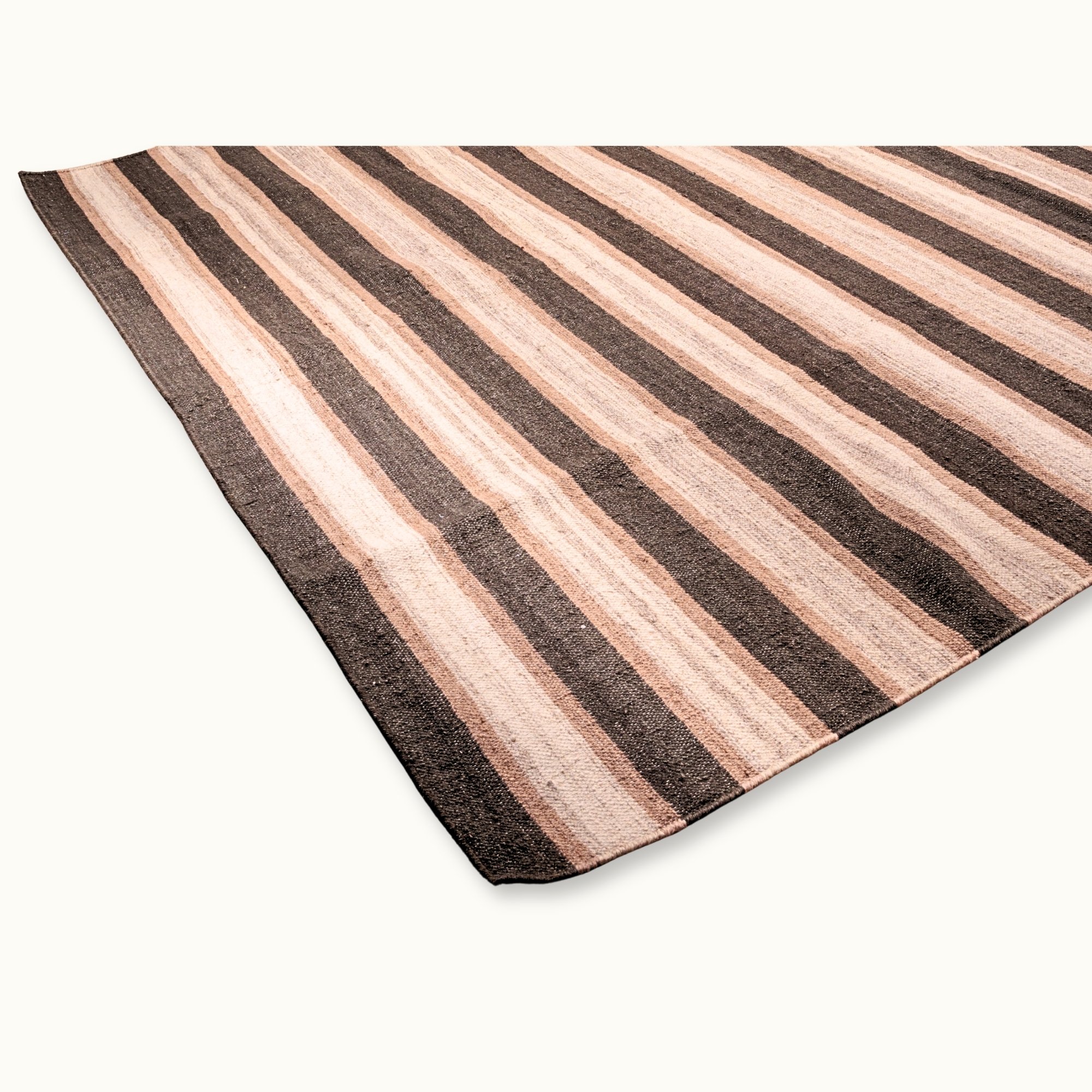 Dhaariya Mitti handwoven striped wool rug with brown and natural tones, earthy flatweave design