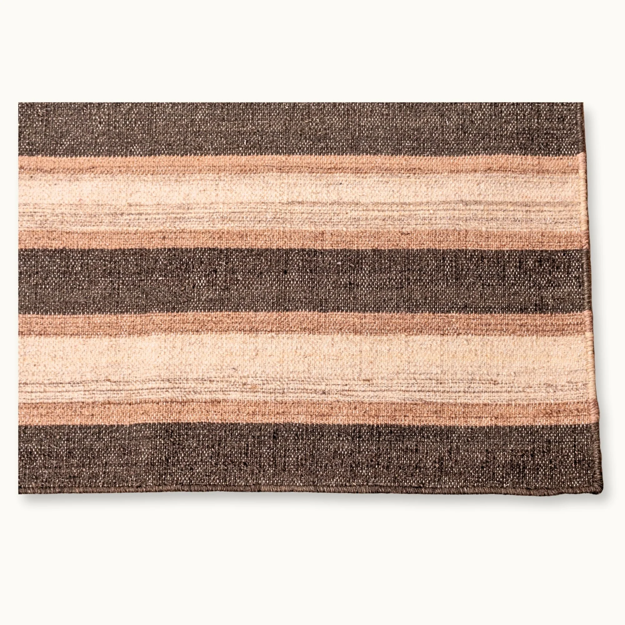 Dhaariya Mitti handwoven striped wool rug with brown and natural tones, earthy flatweave design