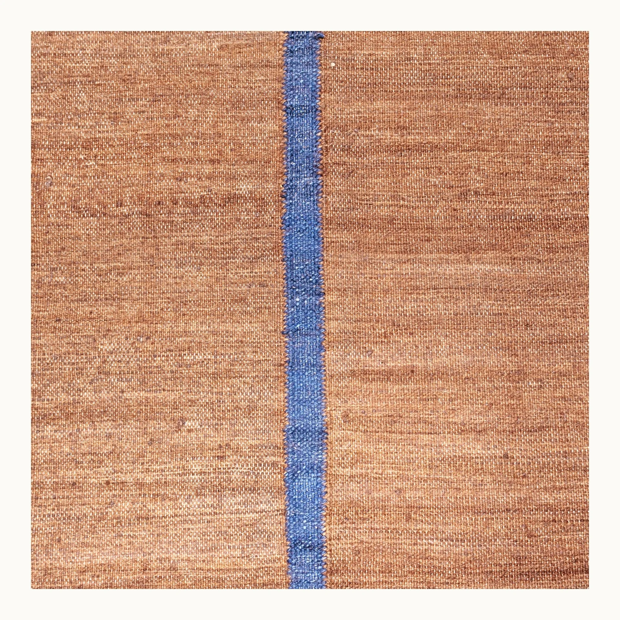 Lakir Neel handwoven wool rug with brown tones and a single blue vertical line, minimal flatweave design