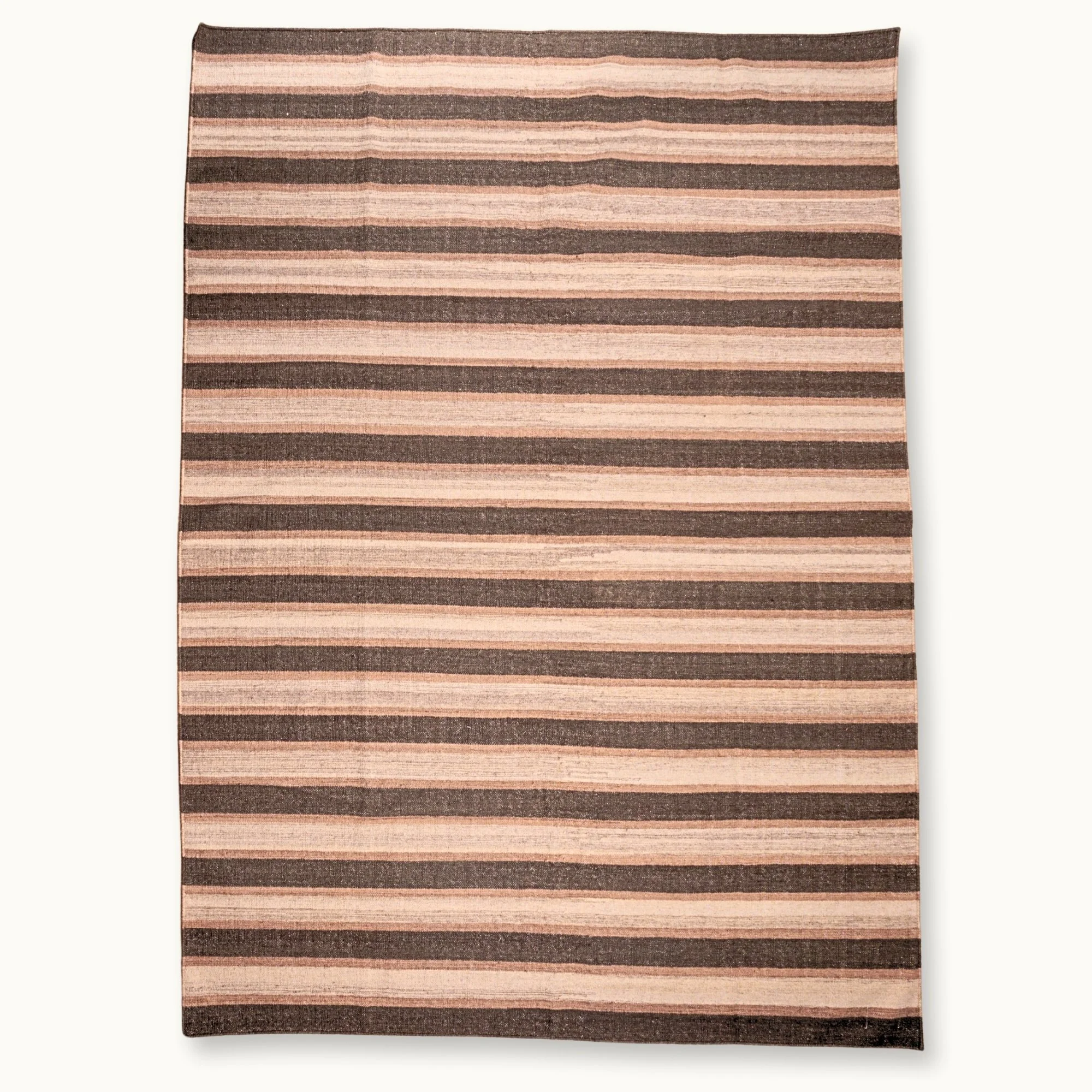 Dhaariya Mitti handwoven striped wool rug with brown and natural tones, earthy flatweave design