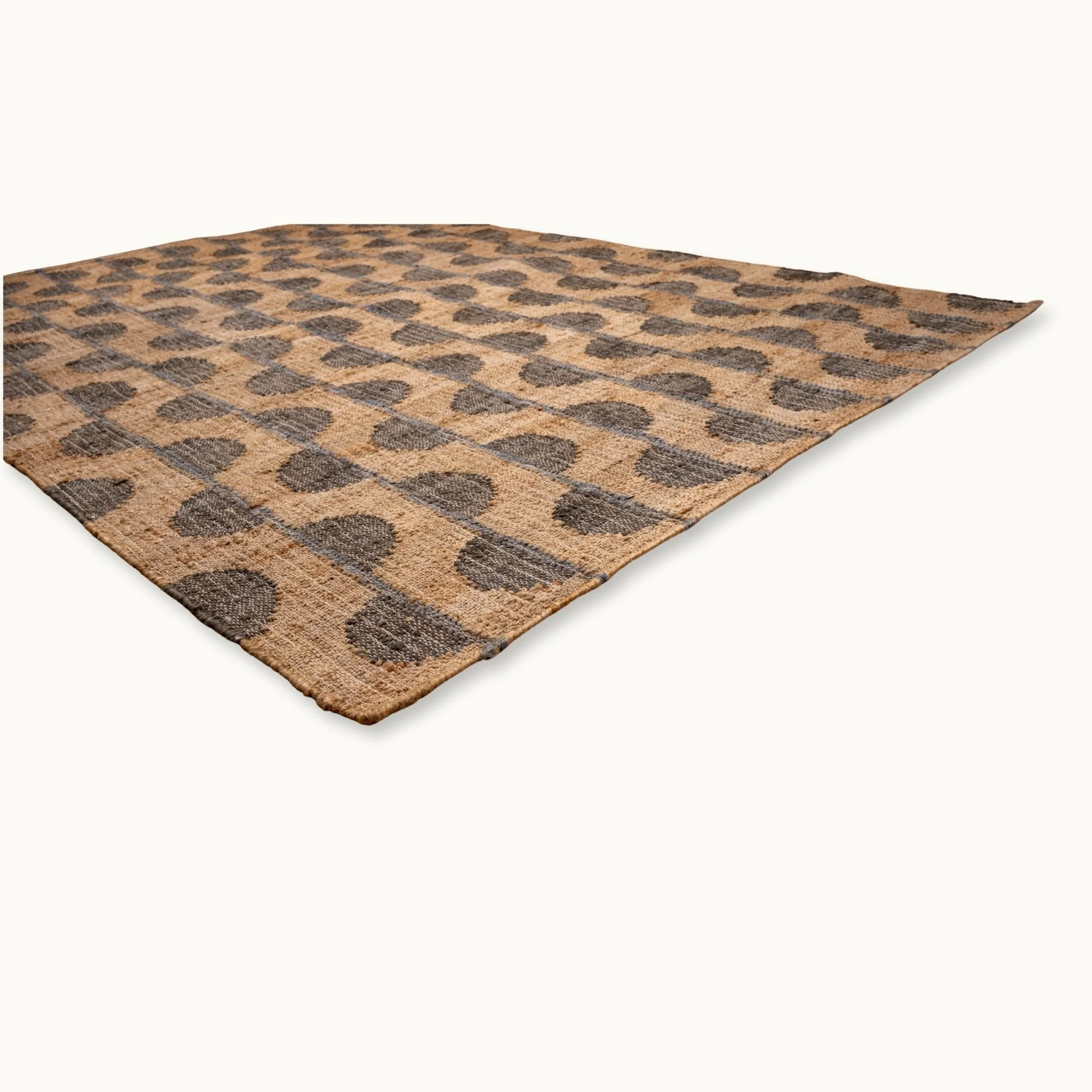 Handwoven jute rug with repeating half-moon pattern in muted olive green and natural sand tones.