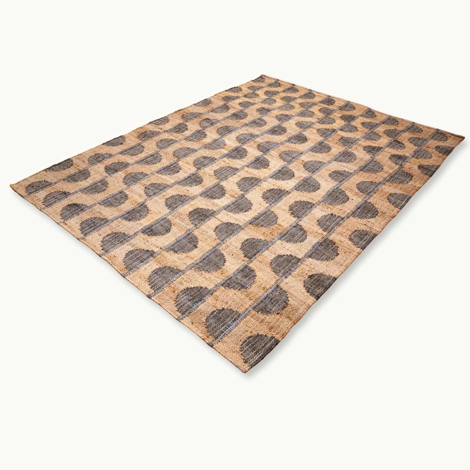 Handwoven jute rug with repeating half-moon pattern in muted olive green and natural sand tones.