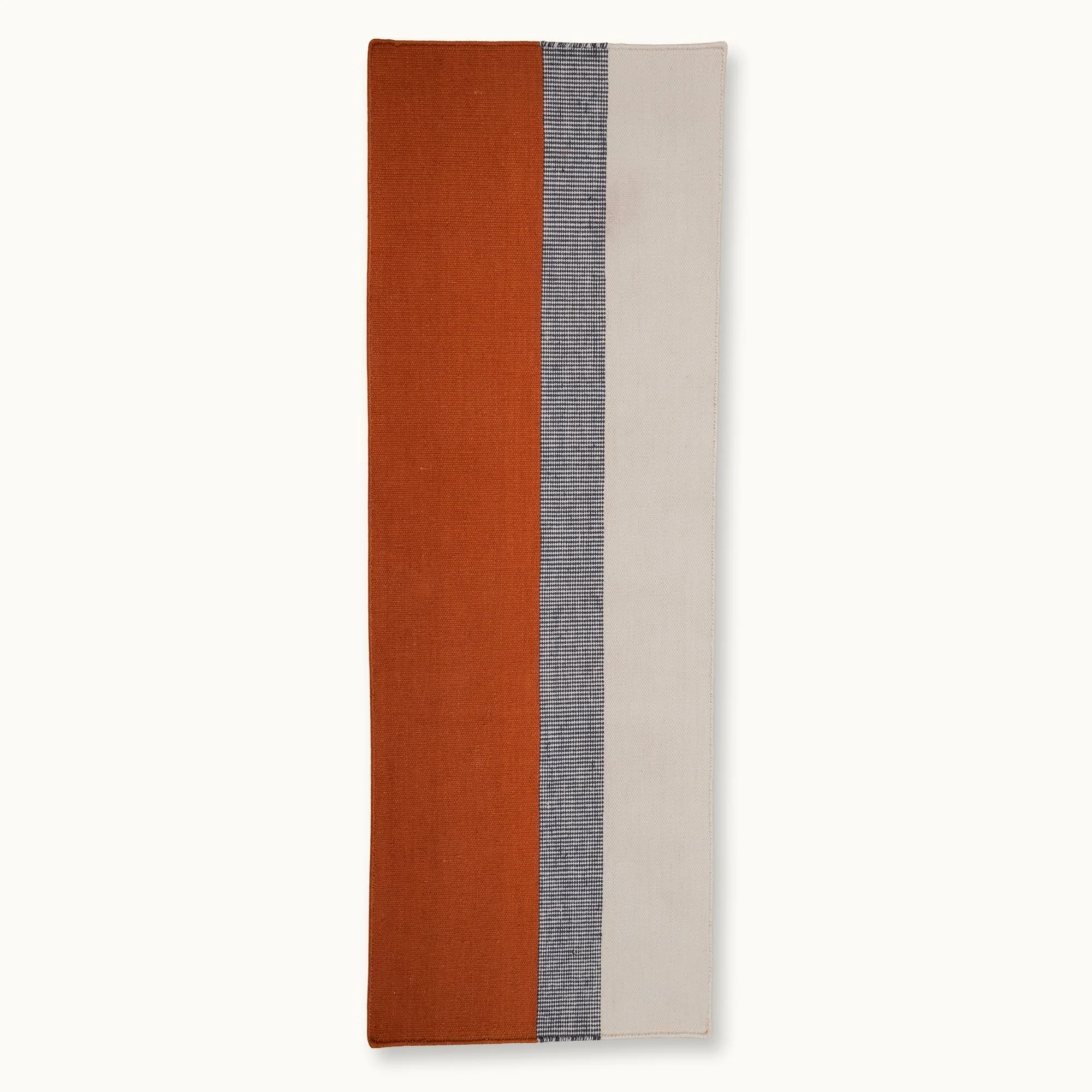 Handwoven striped runner rug in brown, blue and ivory with a modern flatweave design.