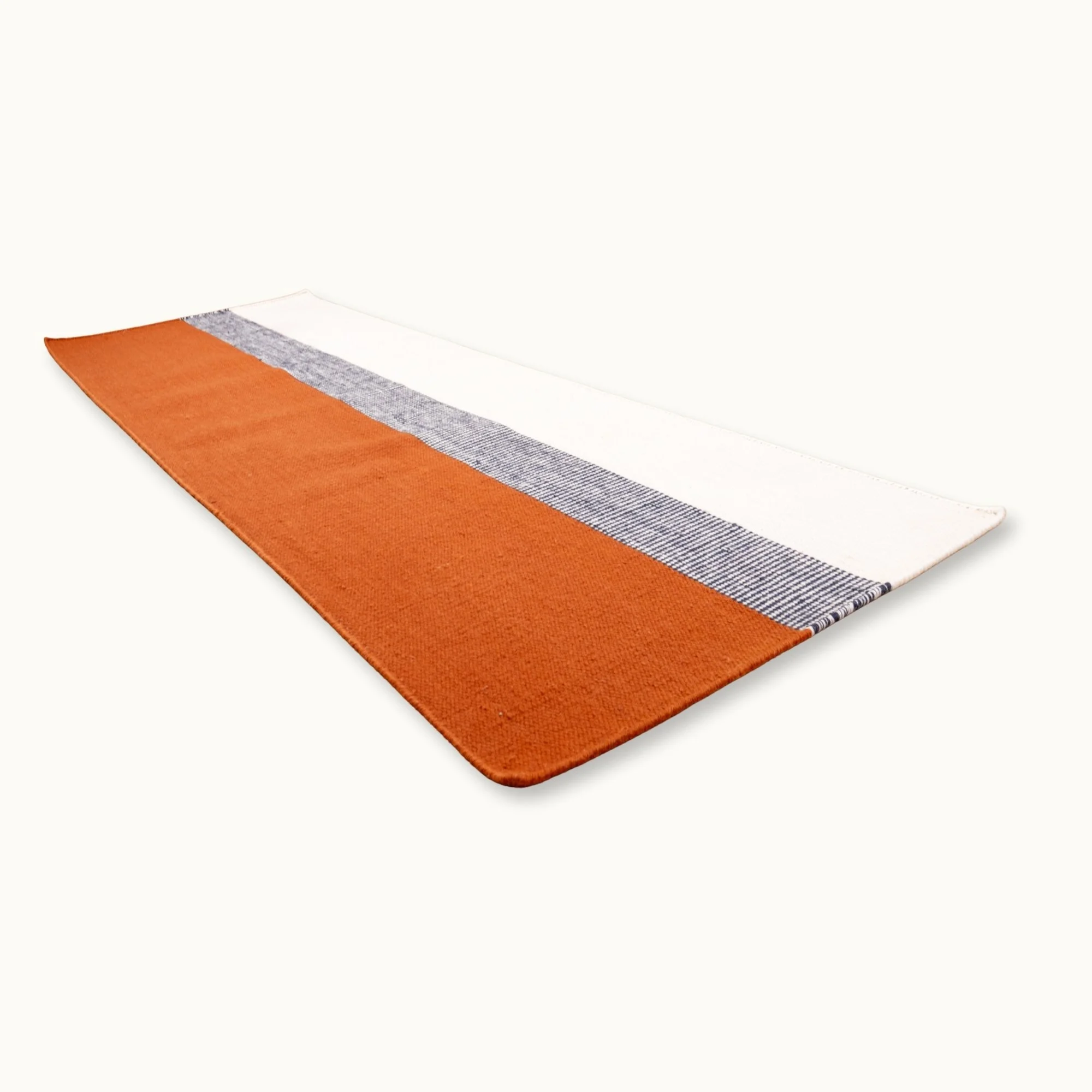 Handwoven striped runner rug in brown, blue and ivory with a modern flatweave design.