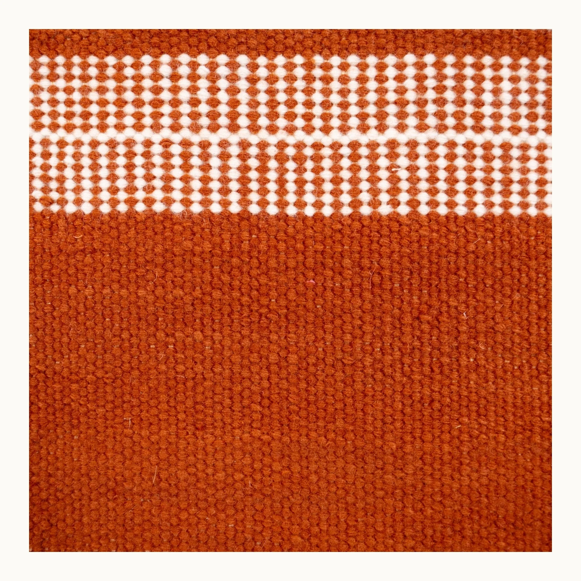 Handwoven striped runner rug in brown and ivory with a modern flatweave design.