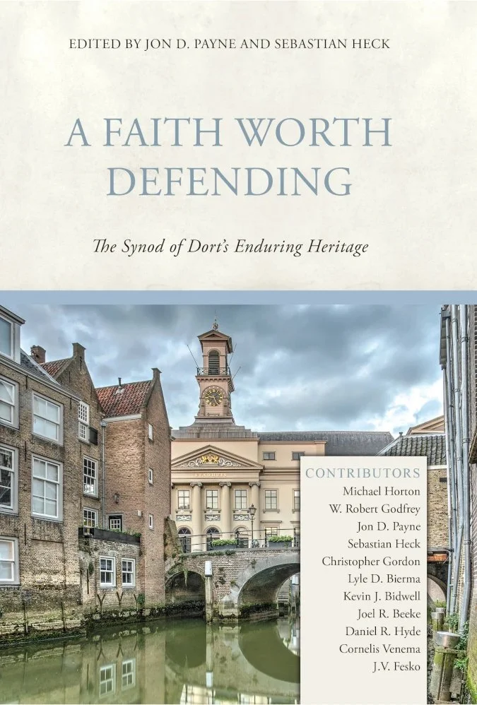 Cover of a book titled 'A Faith Worth Defending: The Synod of Dort's Enduring Heritage' with an image of a historic European cityscape featuring old buildings, a canal, and a clock tower under a cloudy sky.