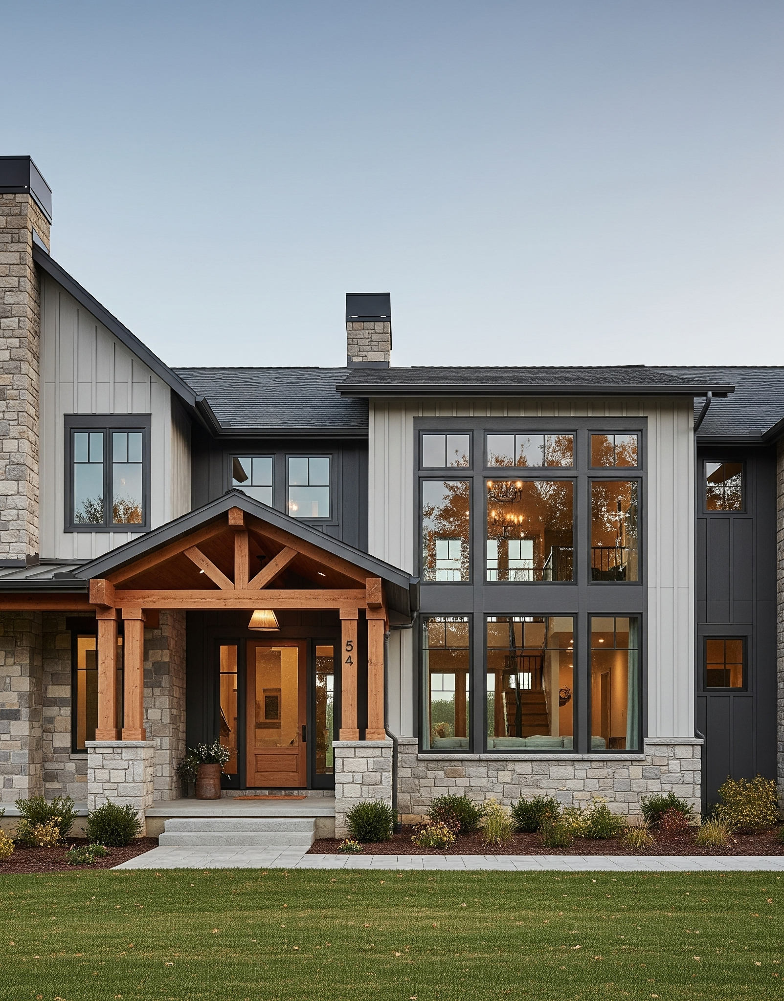 Modern Farmhouse with grey siding, black roof and wood features.