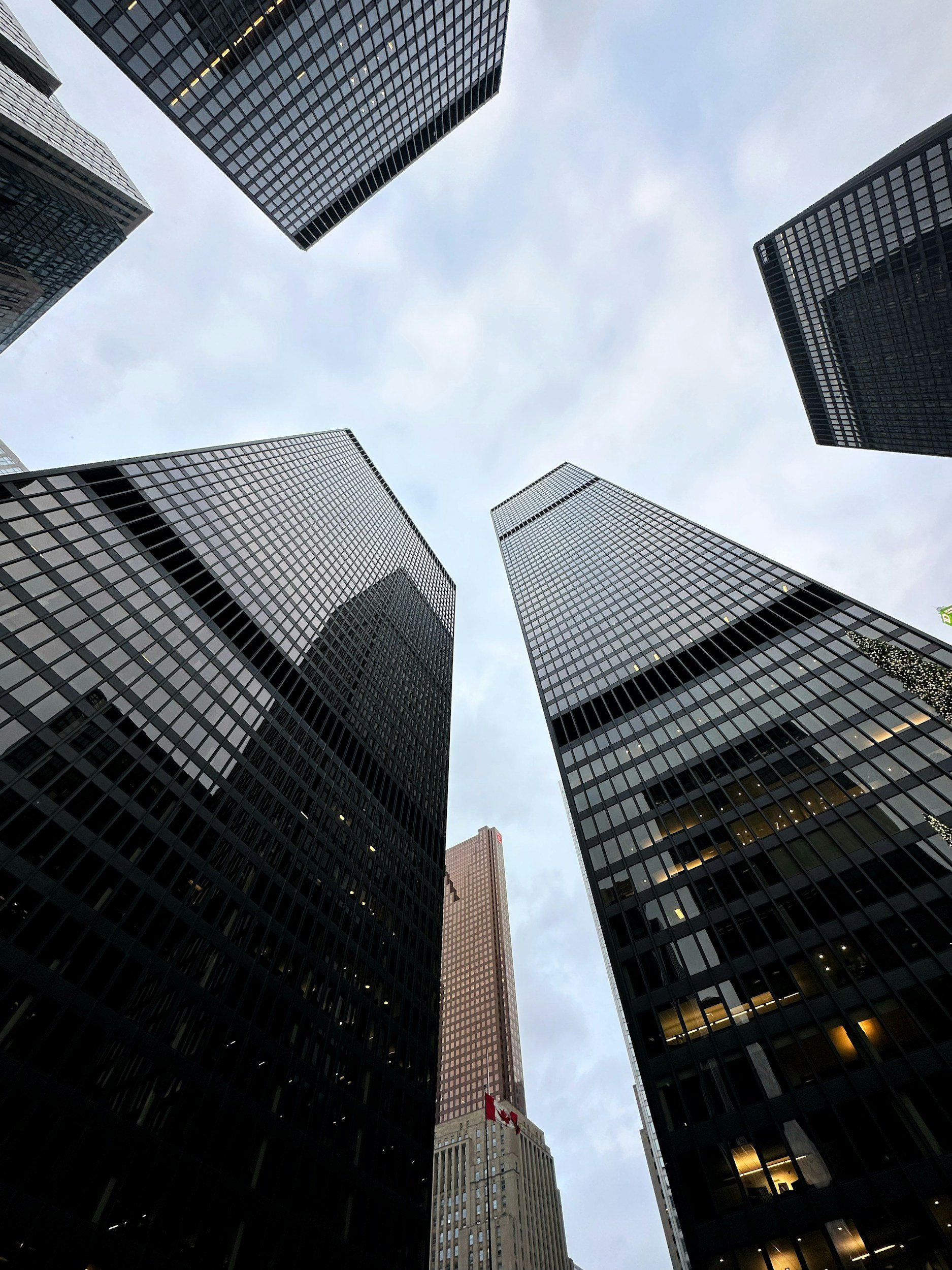 first person view looking up at five tall buildings