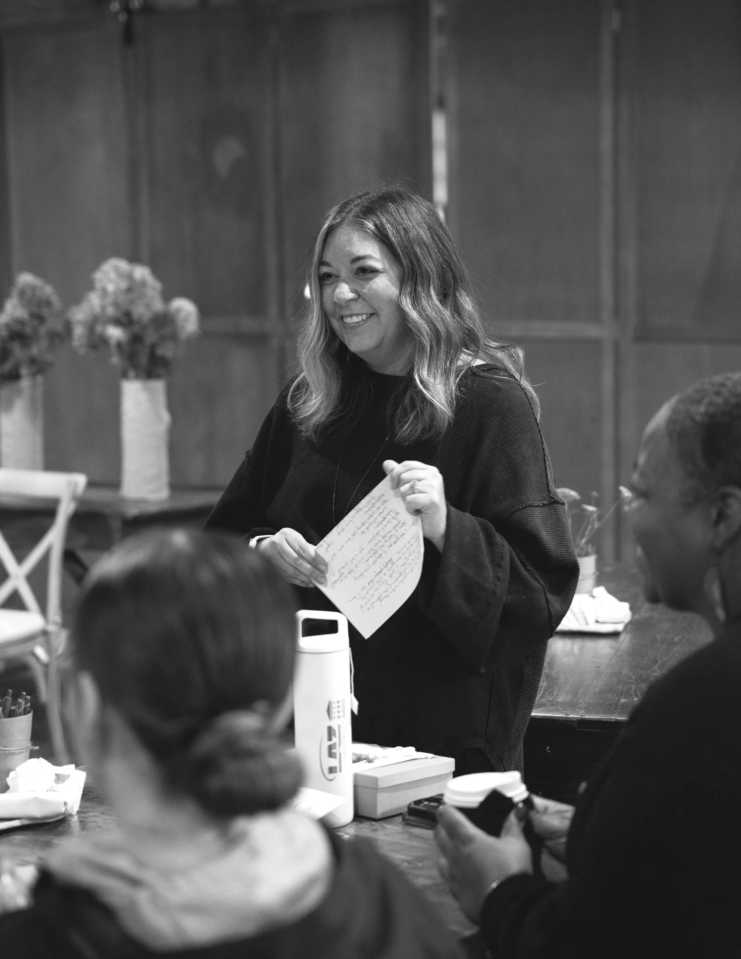 Andi speaking at an event.