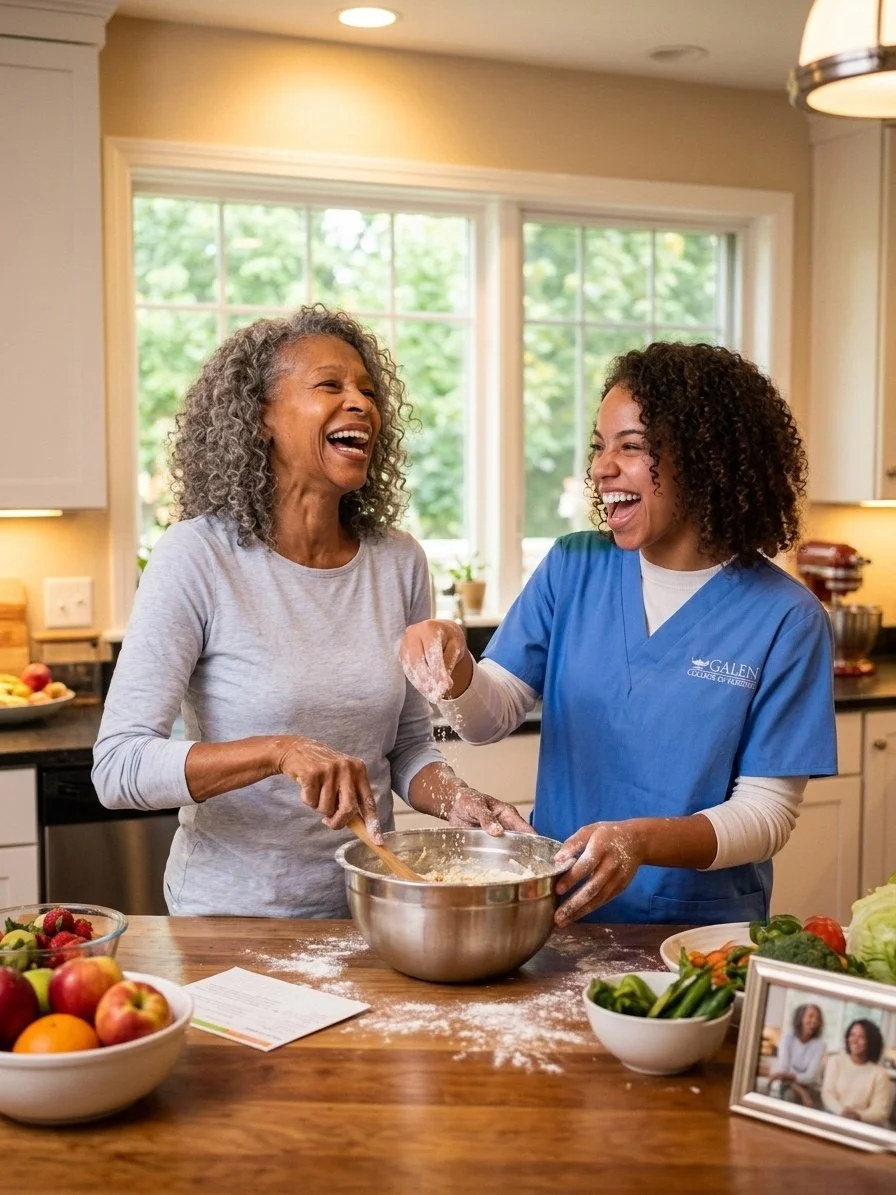 A young woman in blue medical scrubs and an older woman are baking together in a kitchen, laughing and enjoying each other's company.