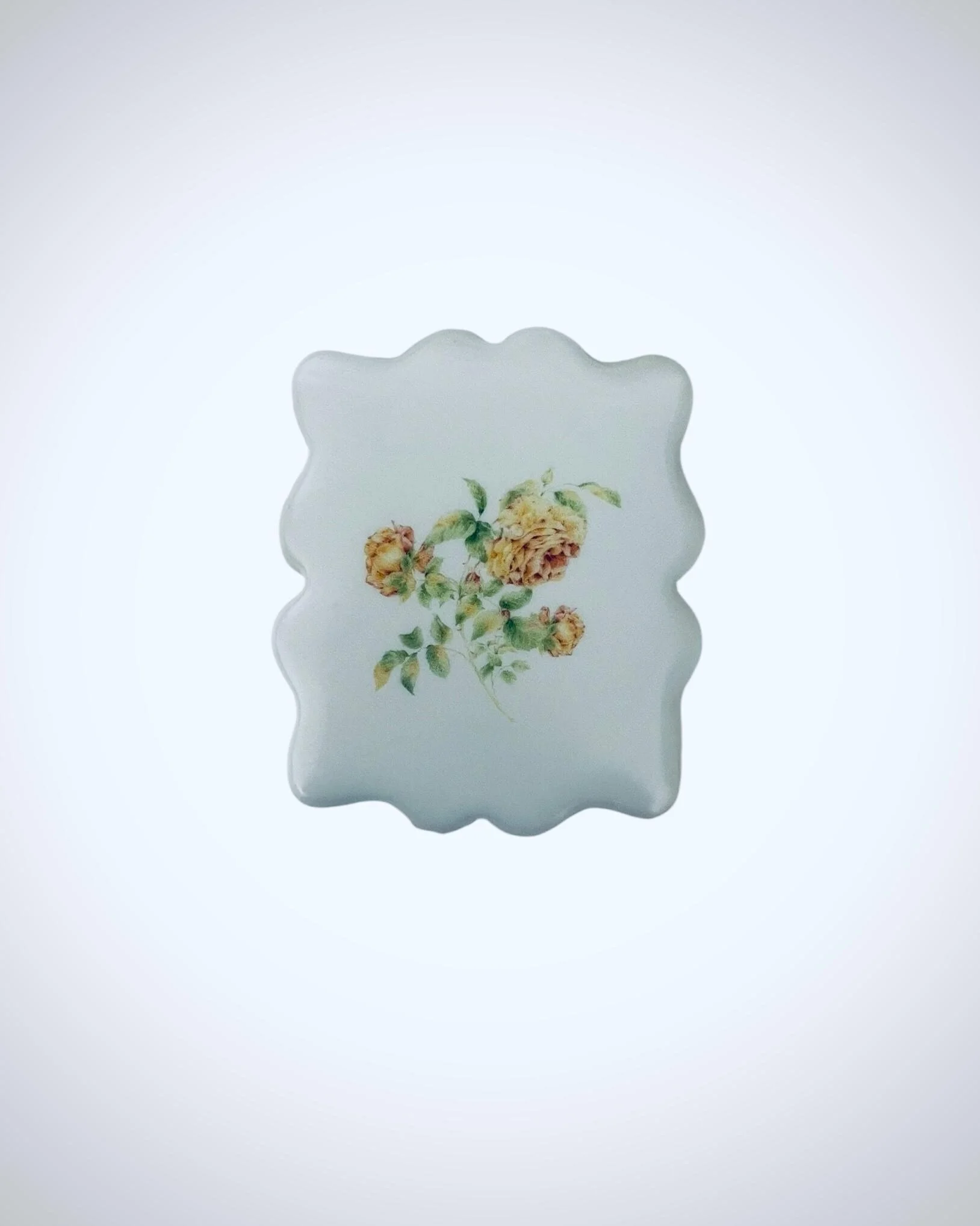 Vintage botanical rose cookies arranged as a set on scalloped sugar cookie