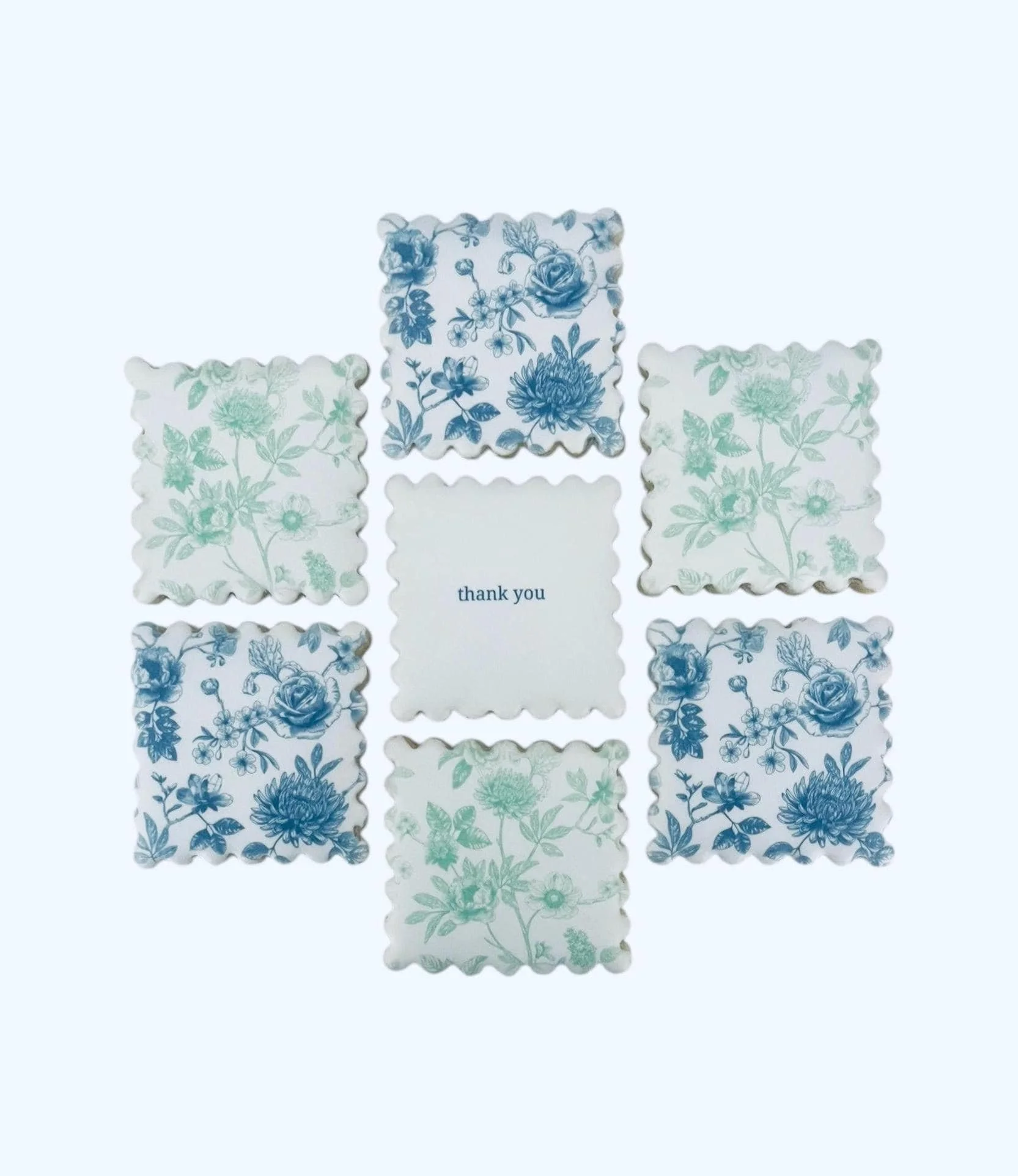 Custom thank you cookies set with blue and green floral design, personalized sugar cookies for gifting and events