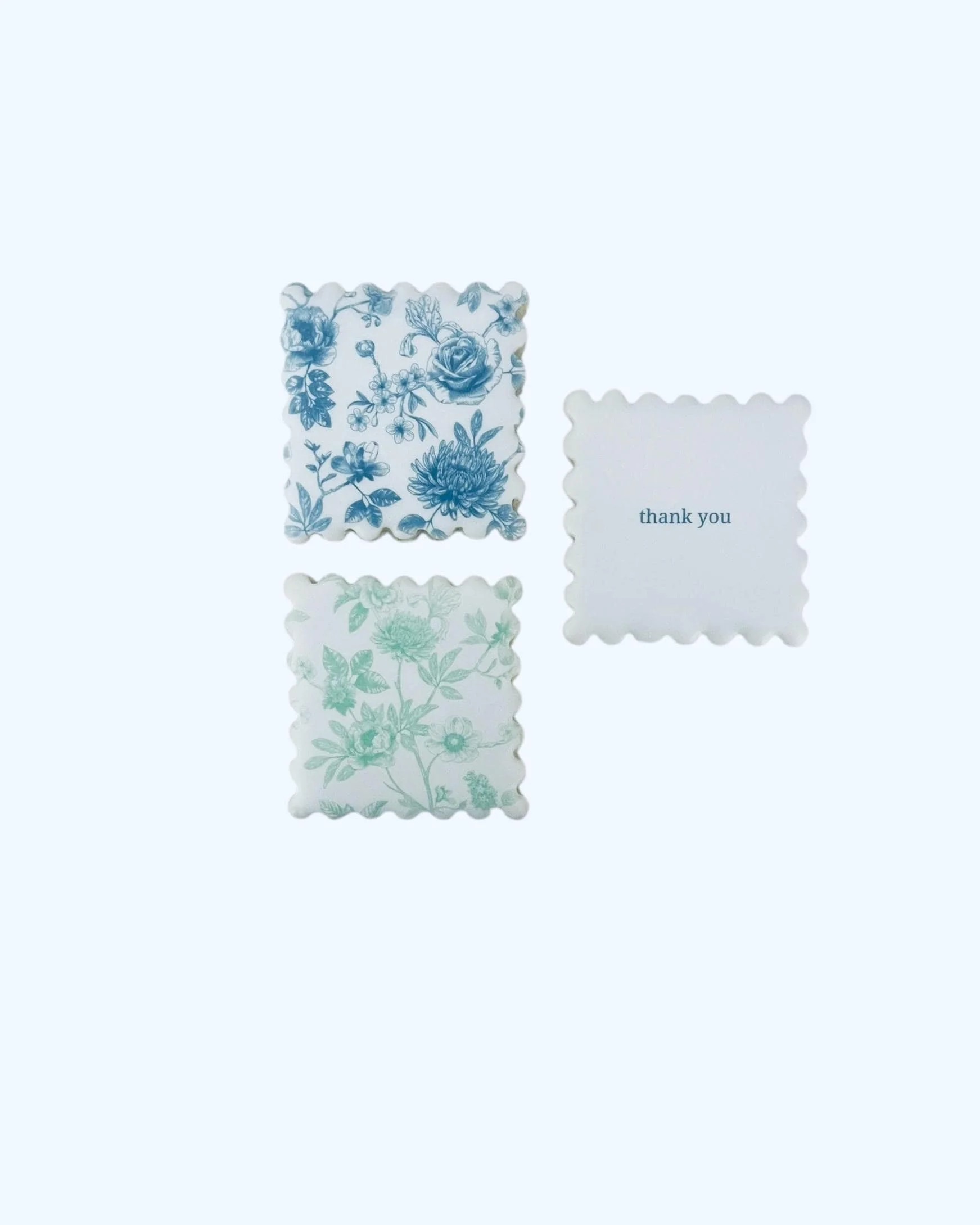 Blue and green floral sugar cookies arranged as a thank you cookie set with custom message option