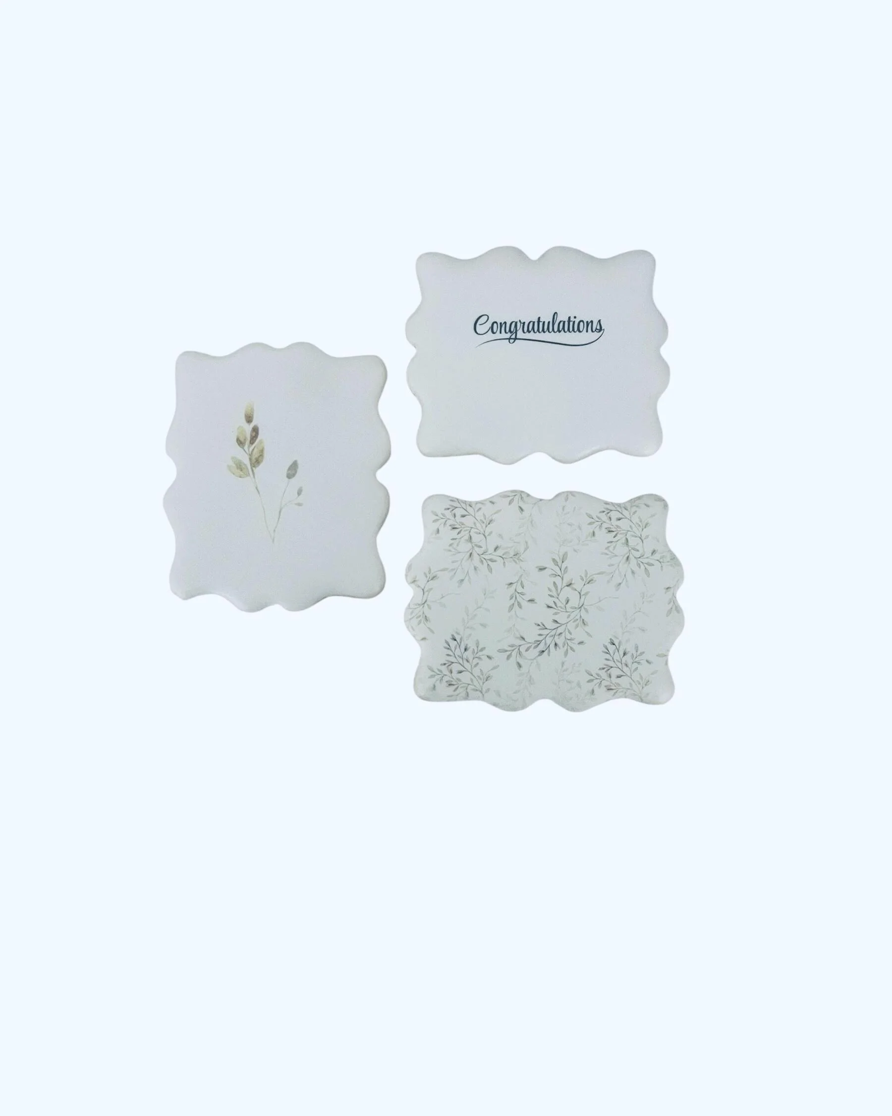 close up of floral stem sugar cookies with congratulations message cookie