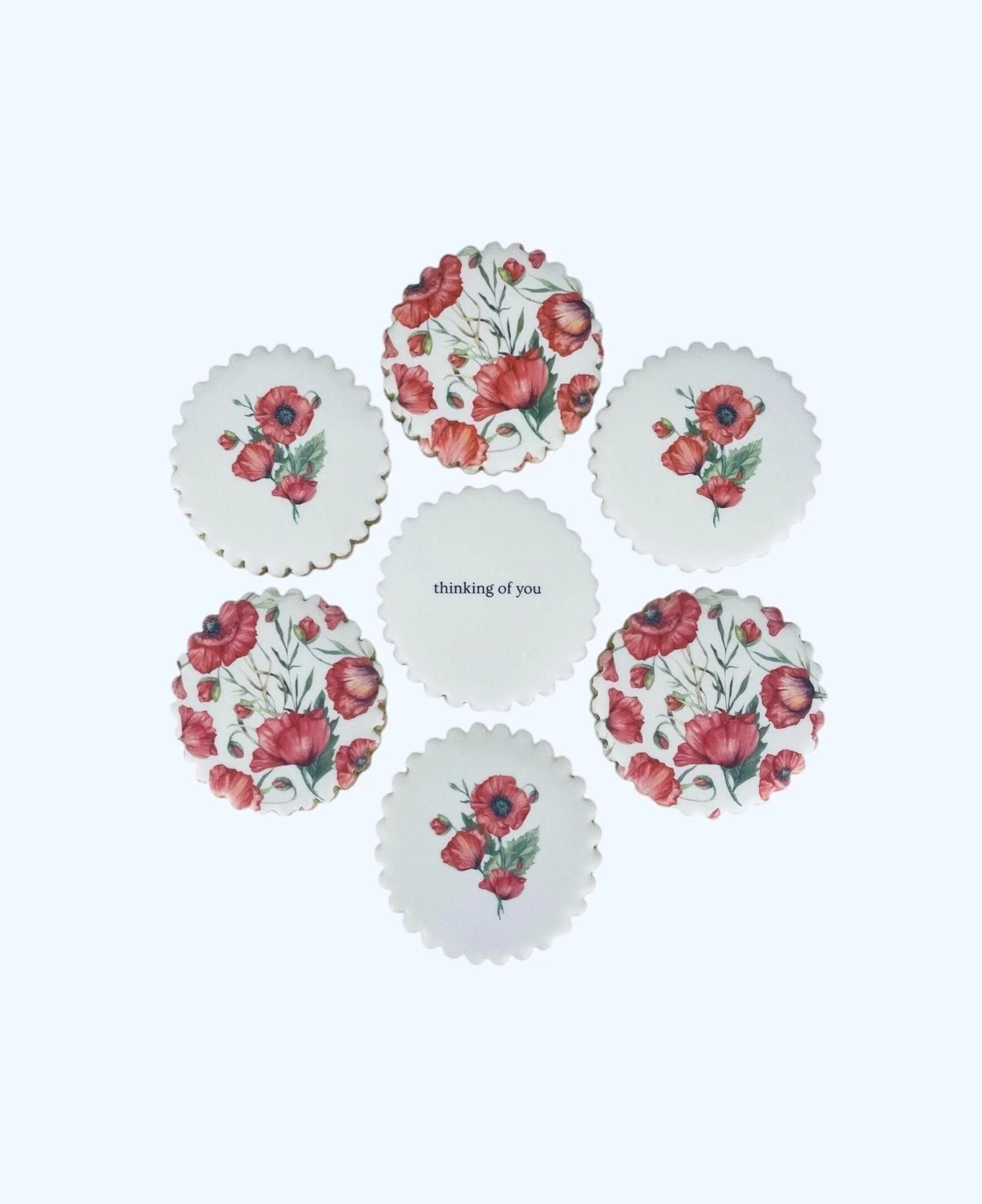 thinking of you cookie set with red poppy floral designs arranged in a circle with a thinking of you centered cookie