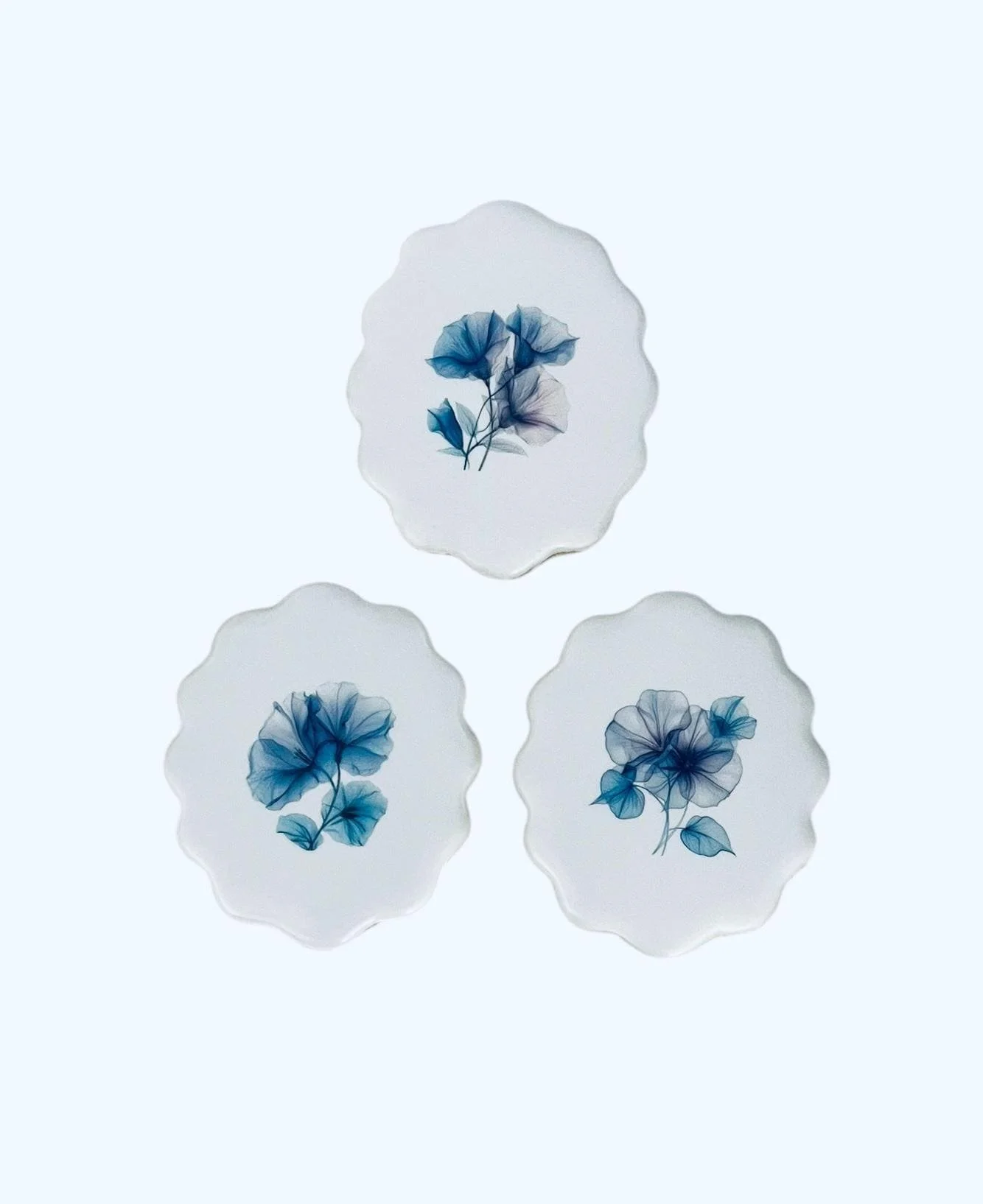 Blue botanical cookies arranged in a floral set with soft tones