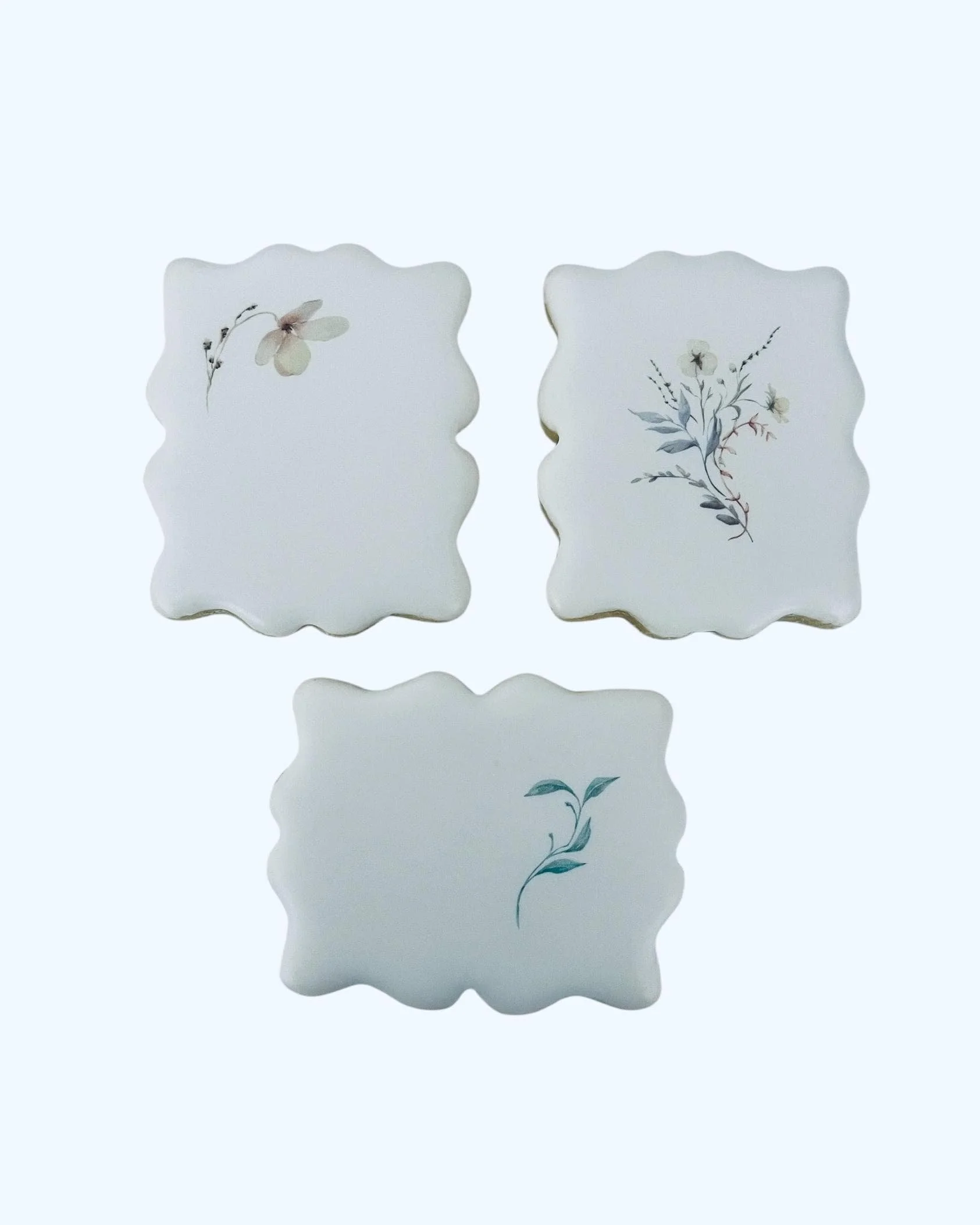 Botanical printed cookies set with soft floral designs arranged together