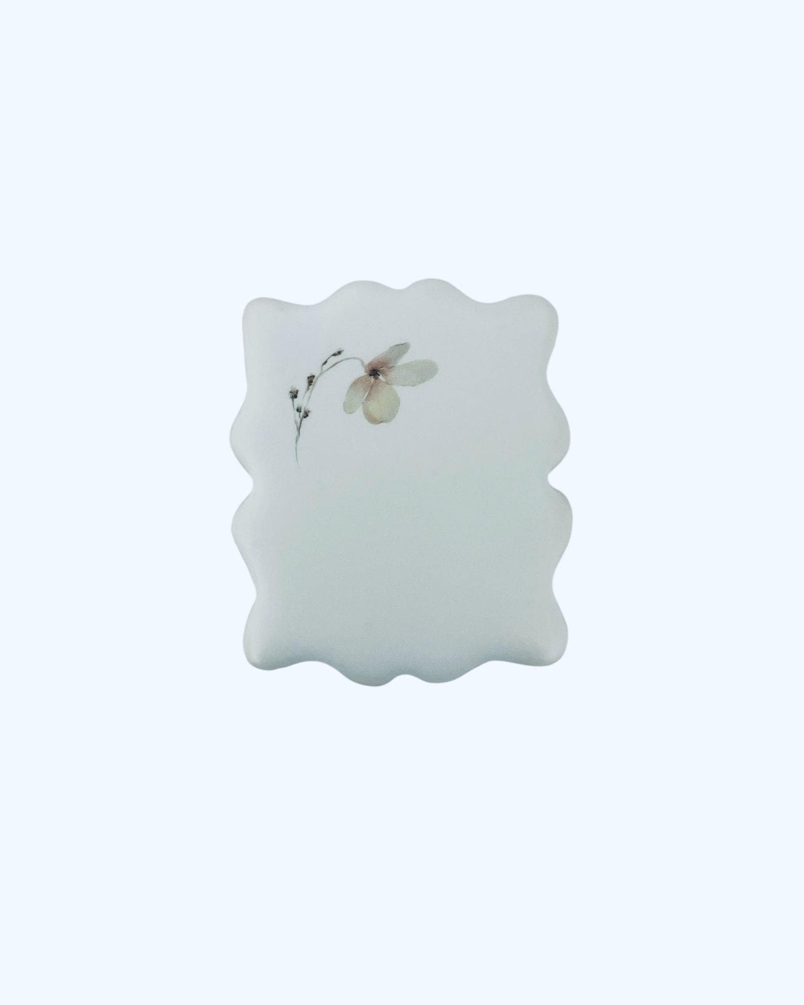 Single floral cookie showing smooth icing and fine detail