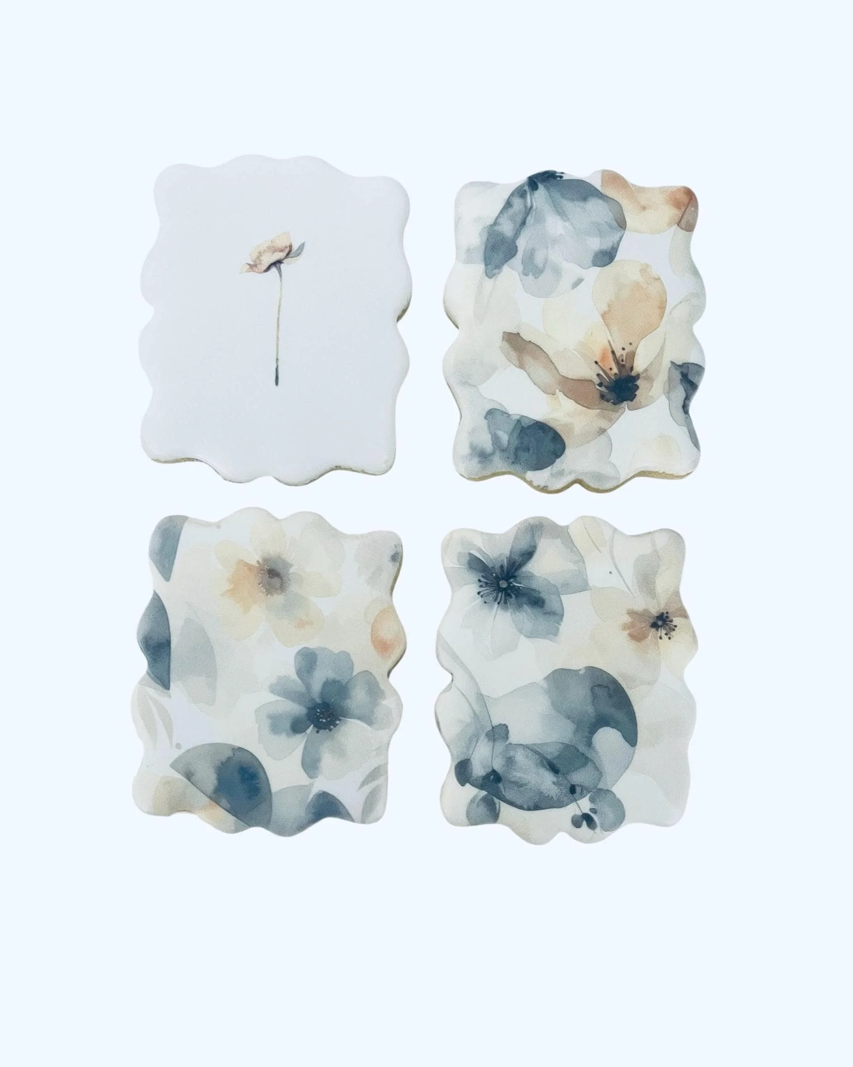 Watercolor floral cookies arranged in a soft spring set